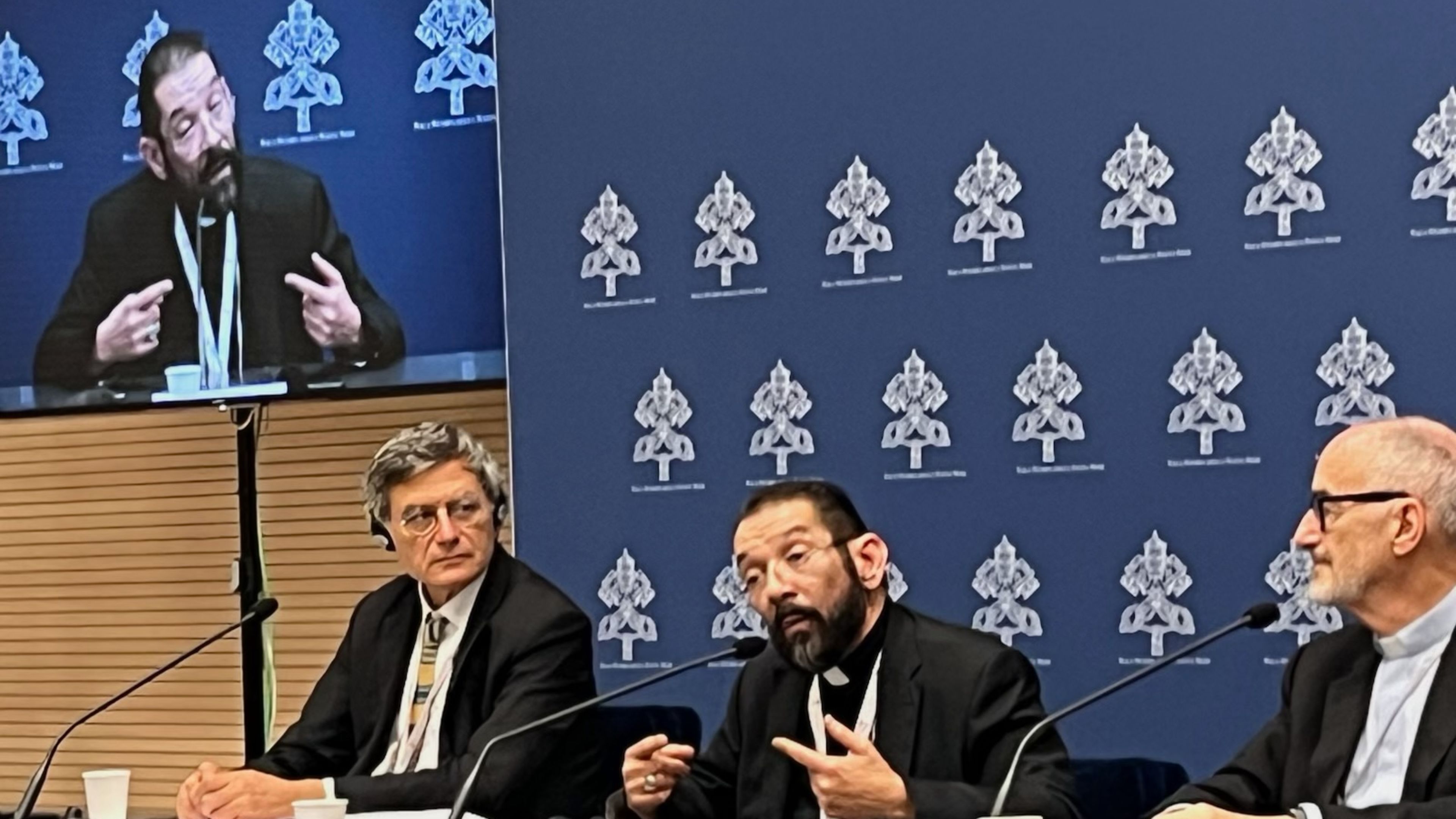 Bishop Daniel E. Flores, center, of the Diocese of Brownsville, Texas, at a press conference during the Synod on Synodality in Rome on Oct. 19, 2023. | Credit: EWTN News
