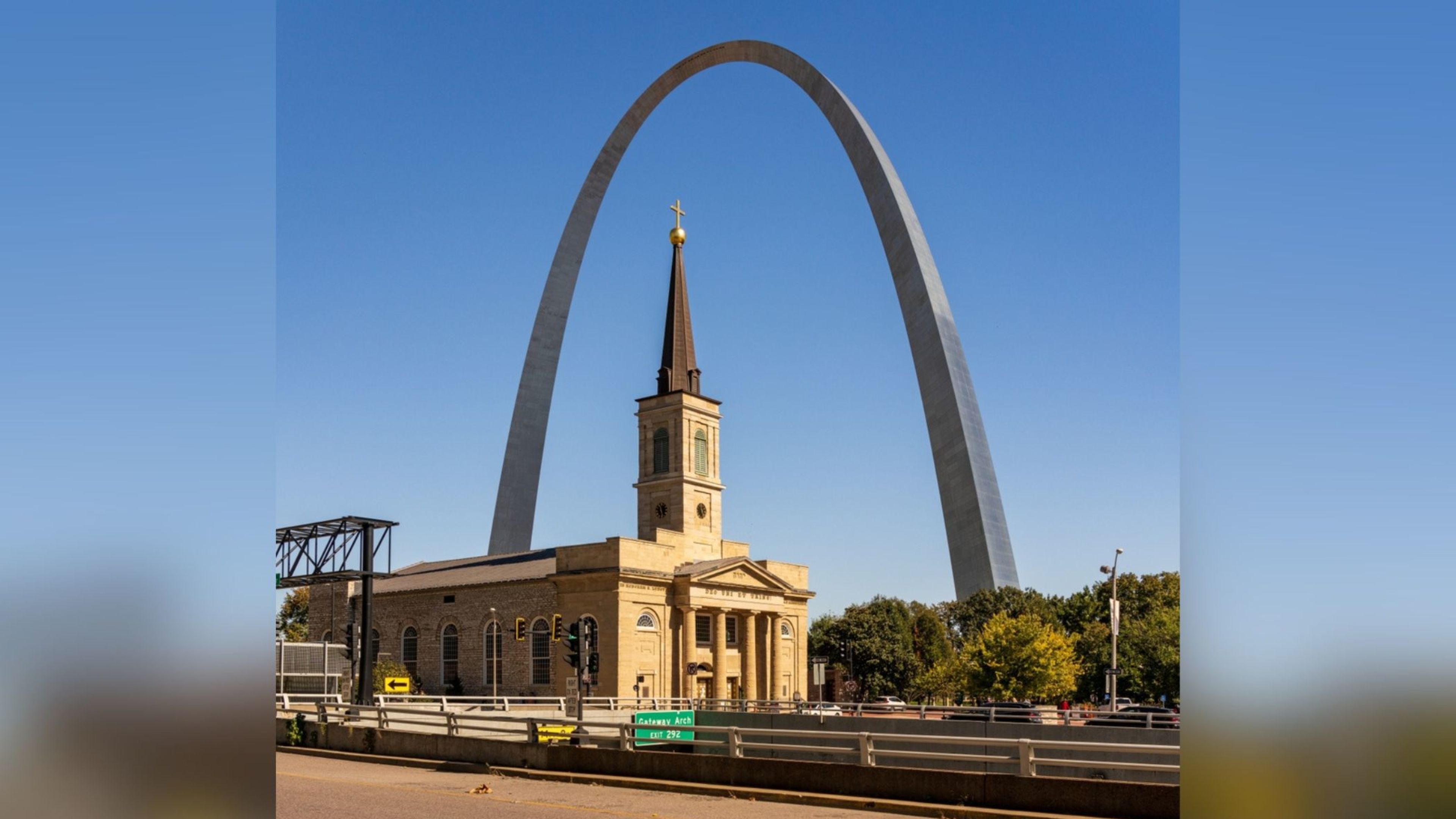 Exterior of the Basilica of St. Louis, King of France framed by the Gateway Arch in St. Louis. | Credit: Steve Heap/Shutterstock