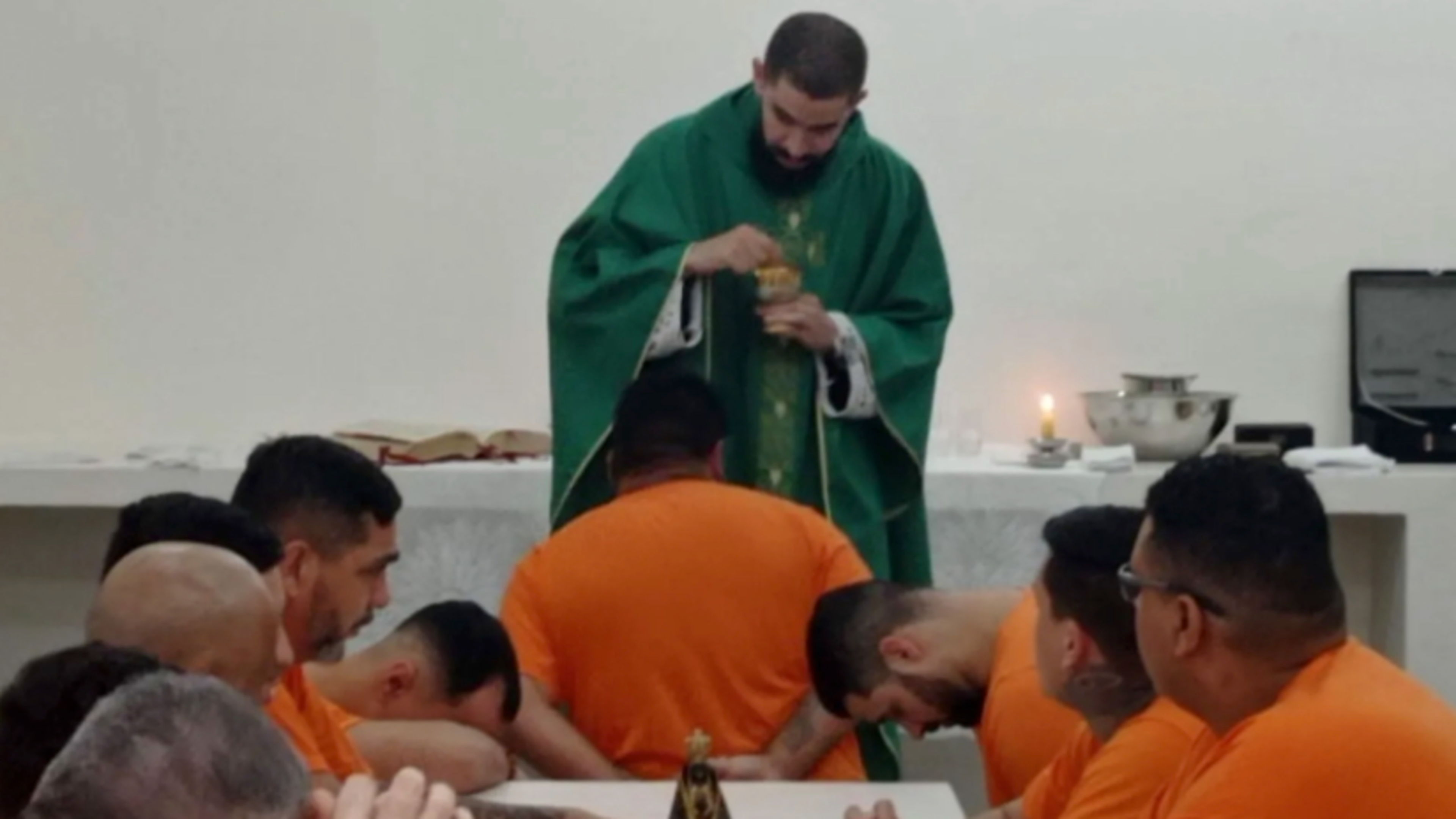 Father Álisson Muryel is shown here administering the sacraments as part of the Archdiocese of Campo Grande’s prison ministry. | Credit: Courtesy of Father Álisson Muryel