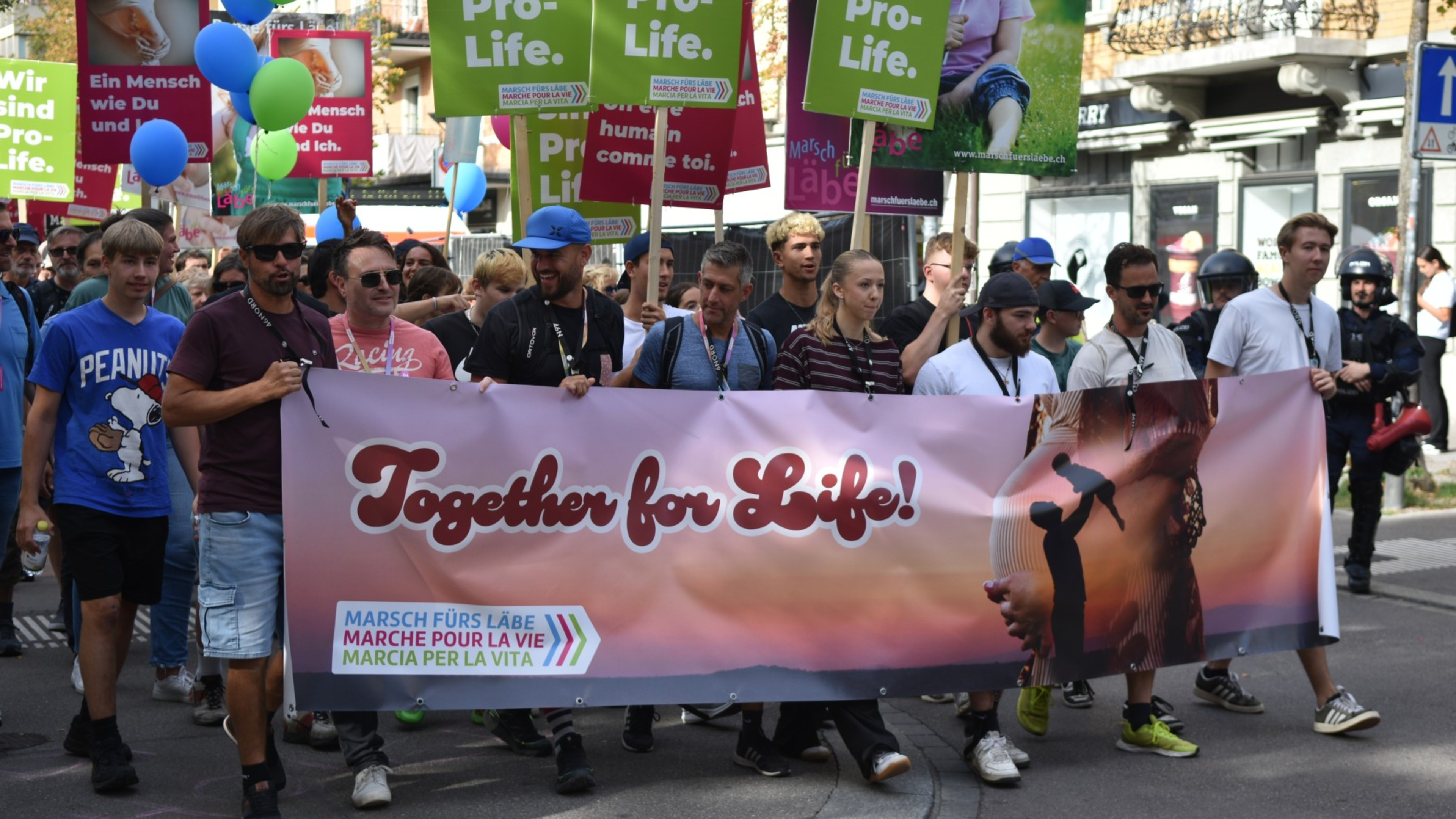 Marchers carry the “Together for Life!” banner through the streets of Zurich’s Oerlikon district during the annual Swiss March for Life, which drew an estimated 2,200 participants, on Sept. 19, 2026. | Credit: Copyright Marsch fürs Läbe