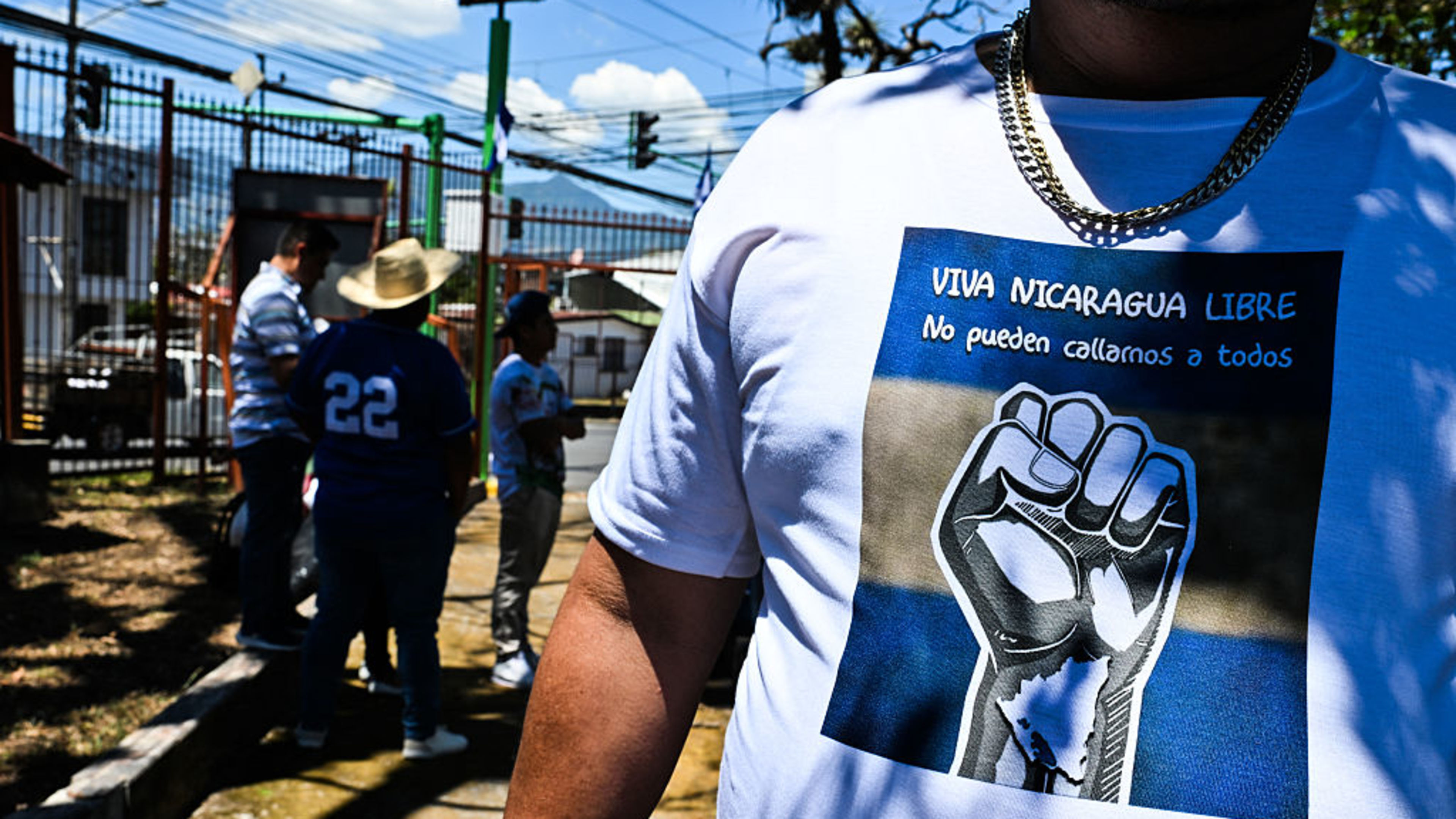 A Nicaraguan man wears a T-shirt reading “Long live free Nicaragua, they cannot silence us all” after Mass at the Church of San Francisco in San Jose, Costa Rica, on April 19, 2026. The service commemorated the anniversary of the 2018 social and political uprising in Nicaragua. | Credit: Ezequiel Becerra/AFP via Getty Images
