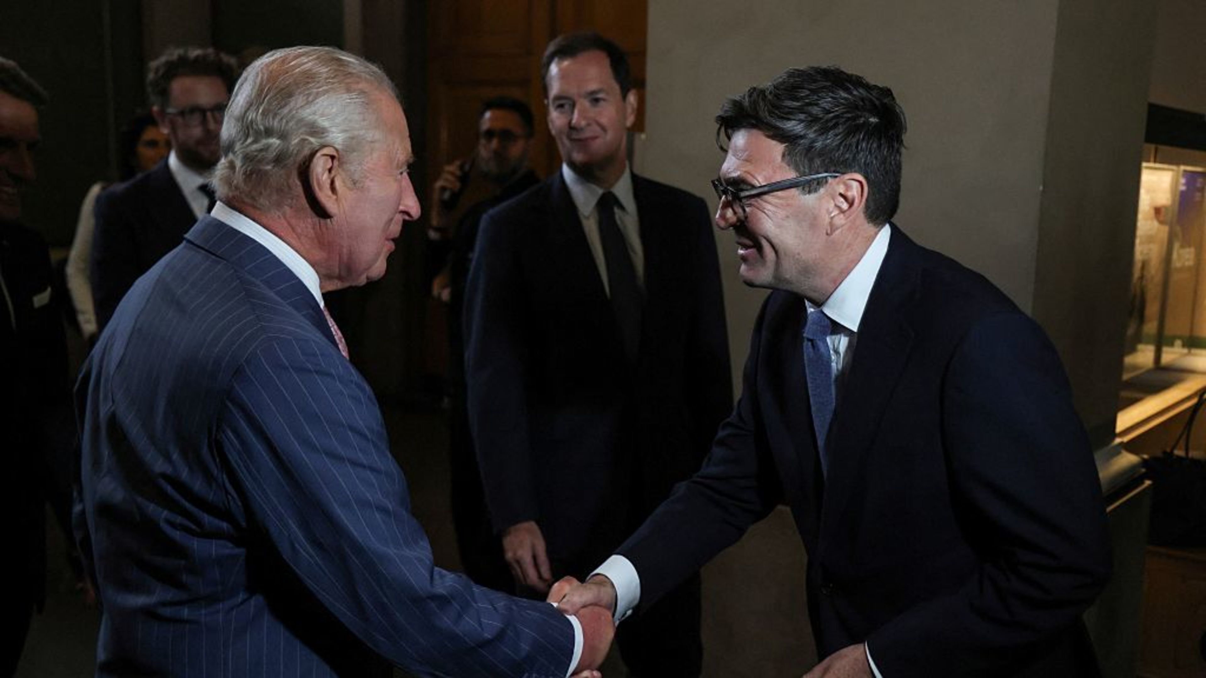 Britain’s King Charles III, left, shakes hands with Britain Prime Minister Andy Burnham as they attend a preview event for the Bayeux Tapestry Exhibition at the British Museum in London on Sept. 2, 2026. | Credit: Ludovic MARIN/POOL/AFP via Getty Images