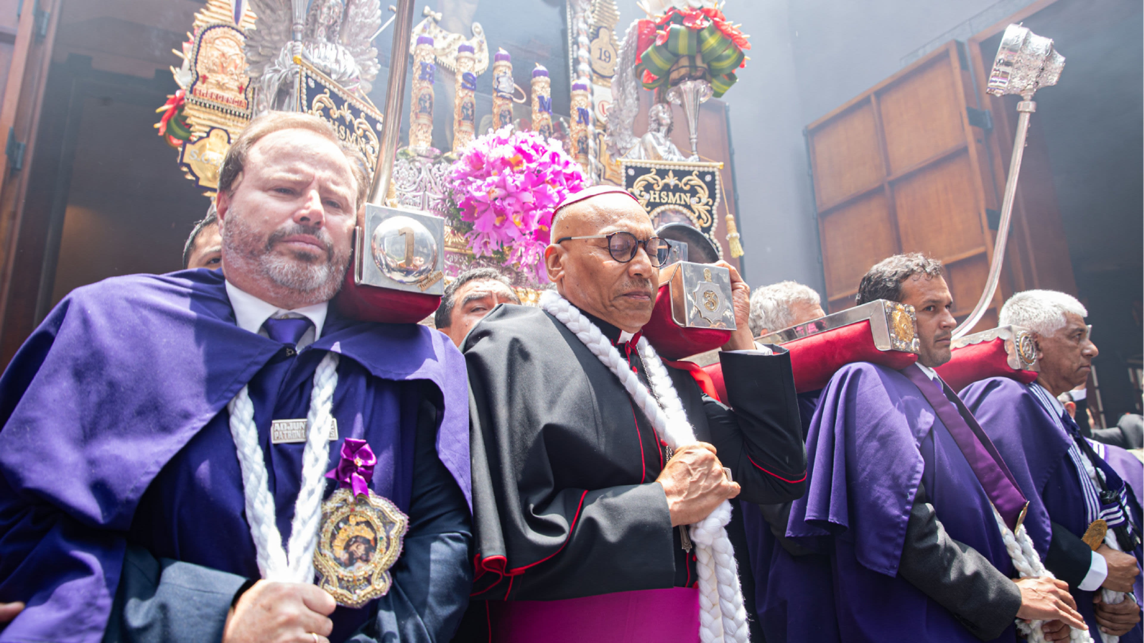 Bishop Guillermo Elías participates in a procession, helping to support the platform that bears the image of the Lord of the Miracles. | Credit: Photo courtesy of the Archdiocese of Lima