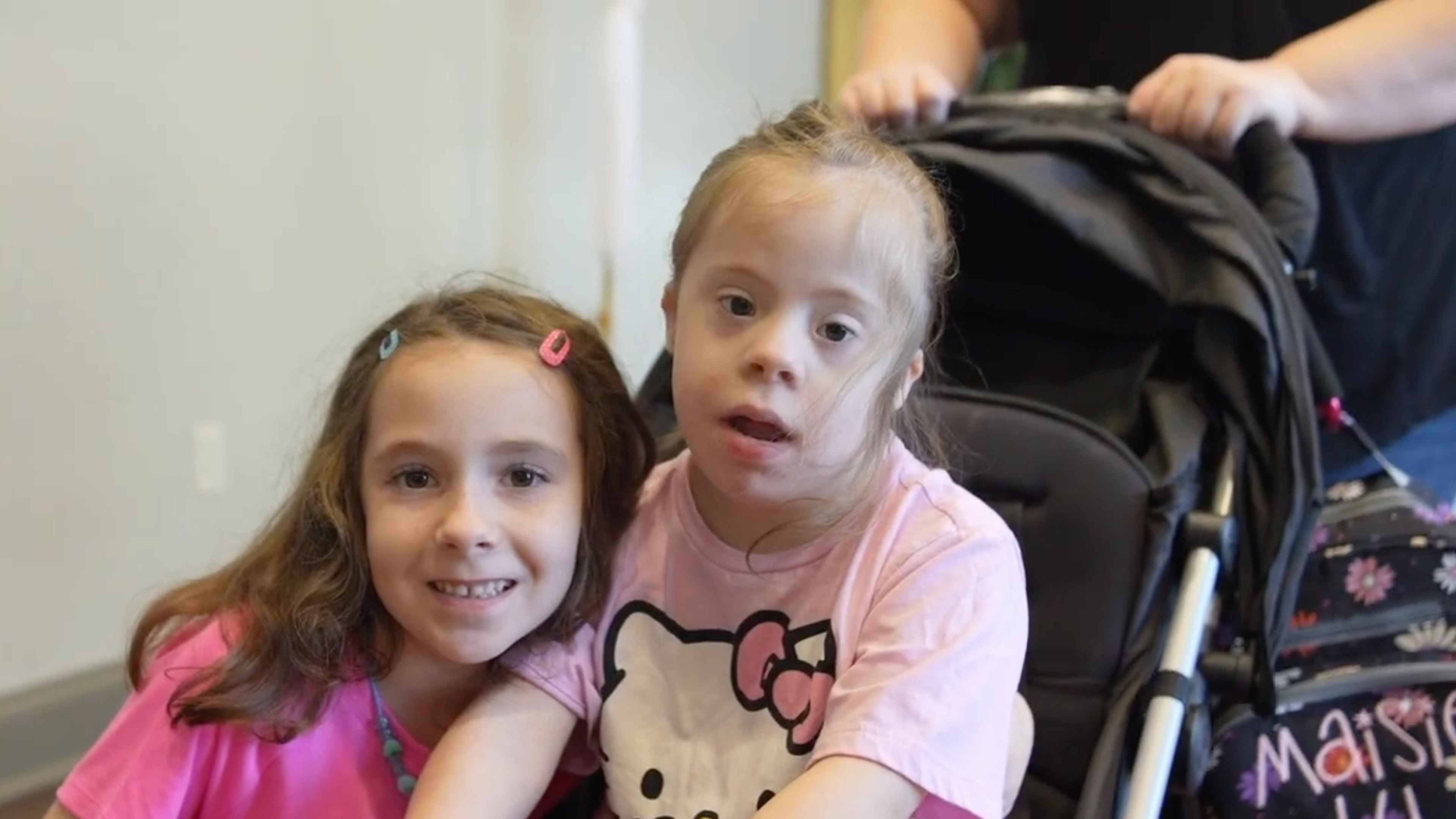 Two sisters attend an All Are Welcome family retreat in 2026 where families gather for prayer, fellowship, games, and support. | Credit: Photo courtesy of All Are Welcome