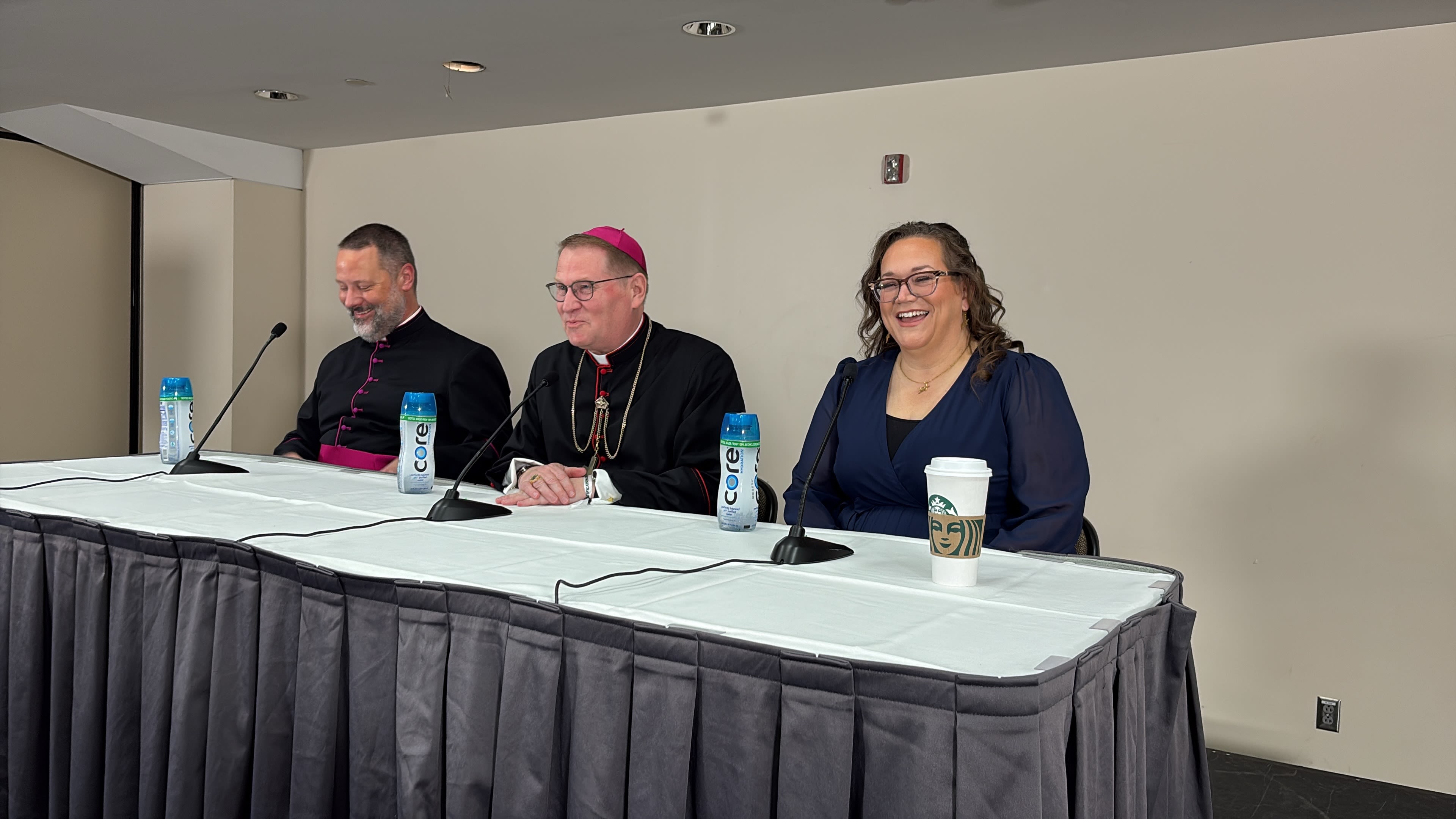 Monsignor Jason Gray, executive director of the Archbishop Fulton J. Sheen Foundation; Bishop Louis Tylka of the Diocese of Peoria, Illinois; and Bonnie Engstrom, who witnessed her newborn child miraculously healed through the intercession of Archbishop Fulton Sheen, speak at a press conference on Sept. 24, 2026. | Credit: Jonah McKeown/EWTN News