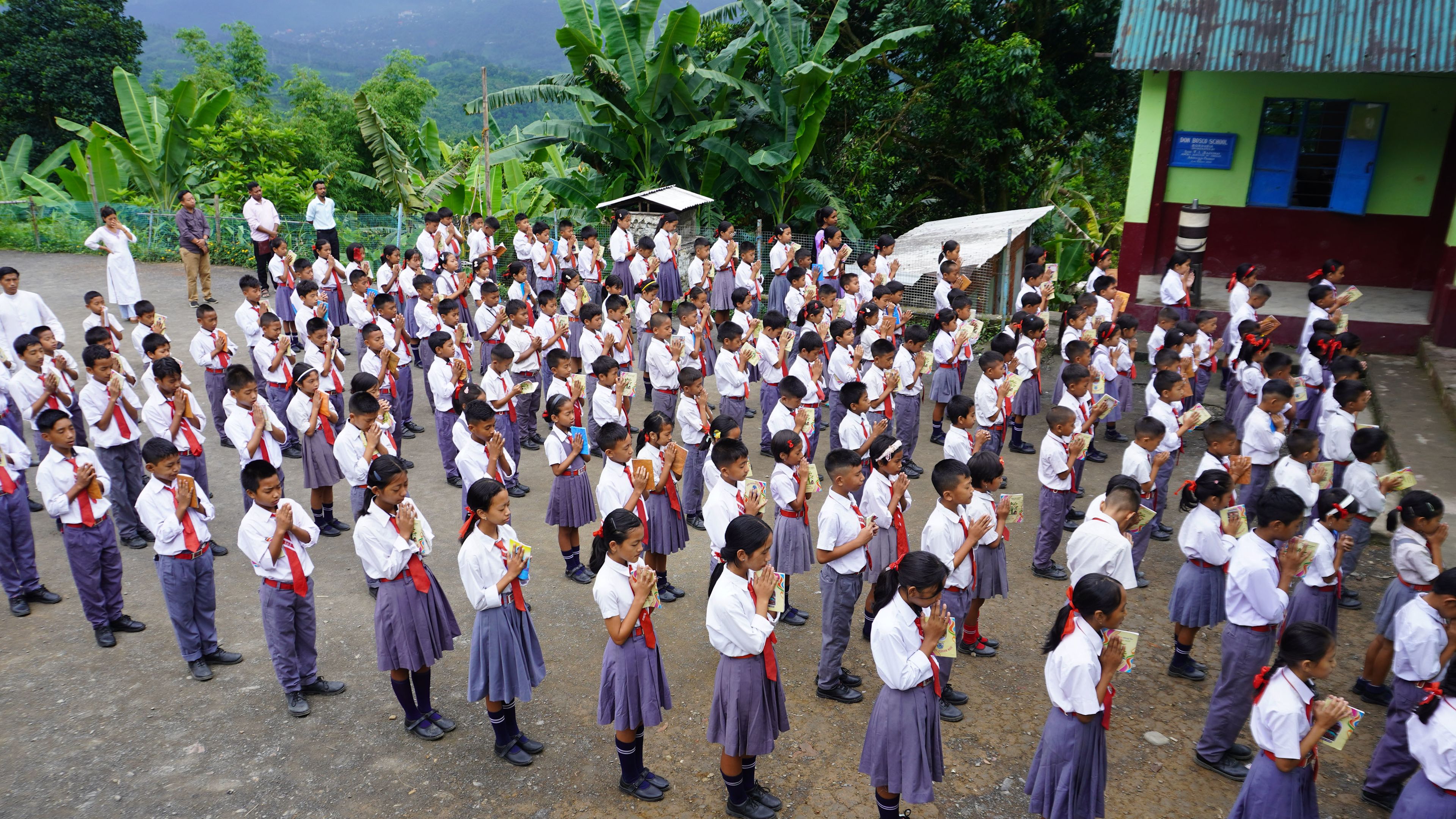 Students pray during morning assembly at a Catholic school in Borduria in Arunachal Pradesh, northeastern India, in July 2025. | Credit: Anto Akkara