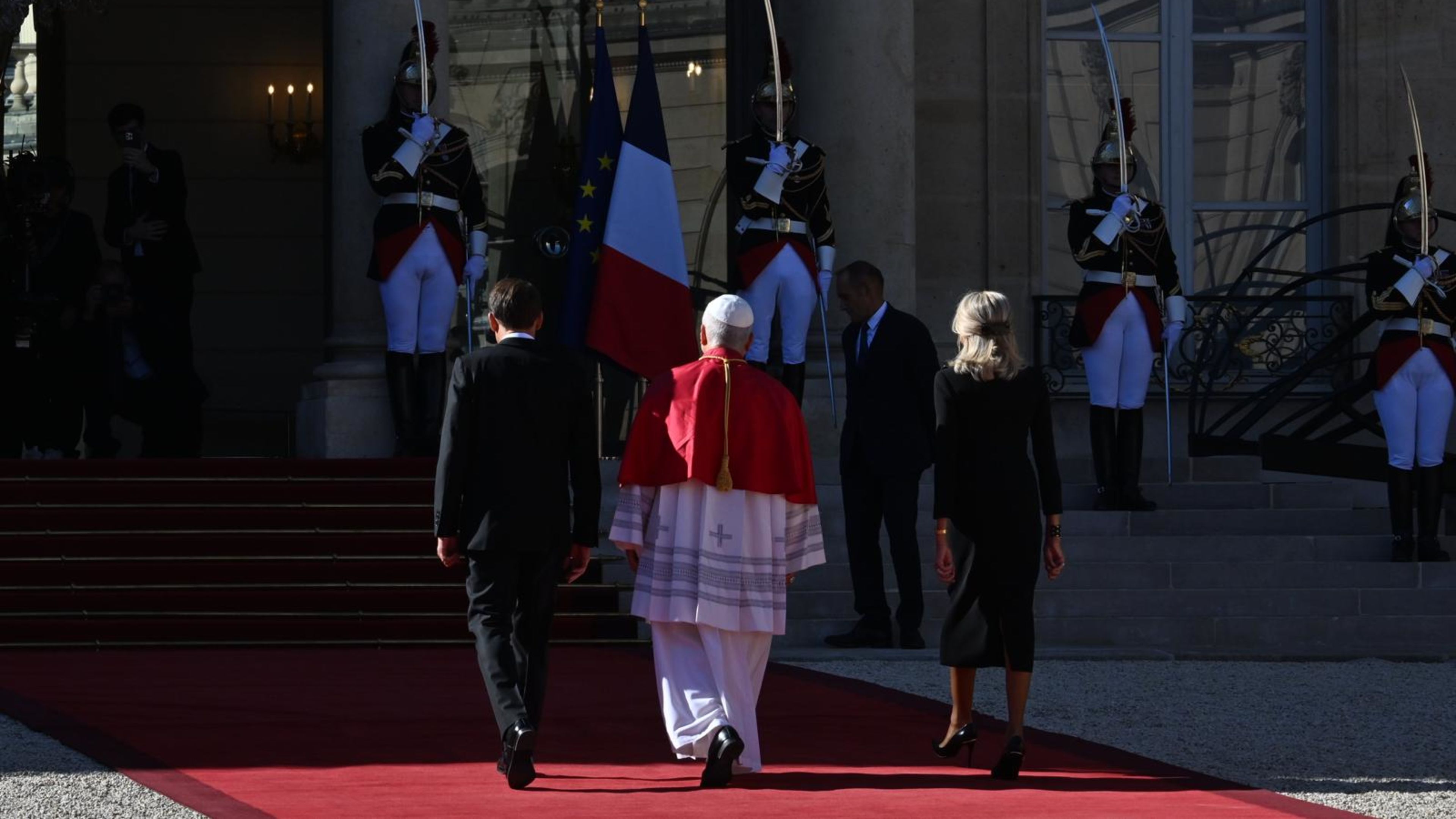 Pope Leo XIV walks with the President of France, Emmanuel Macron, and the first lady of France, Brigitte Macron, at the Élysée Palace in Paris on Sept. 25, 2026. | Credit: Alessia Giuliani/EWTN News/Vatican Pool