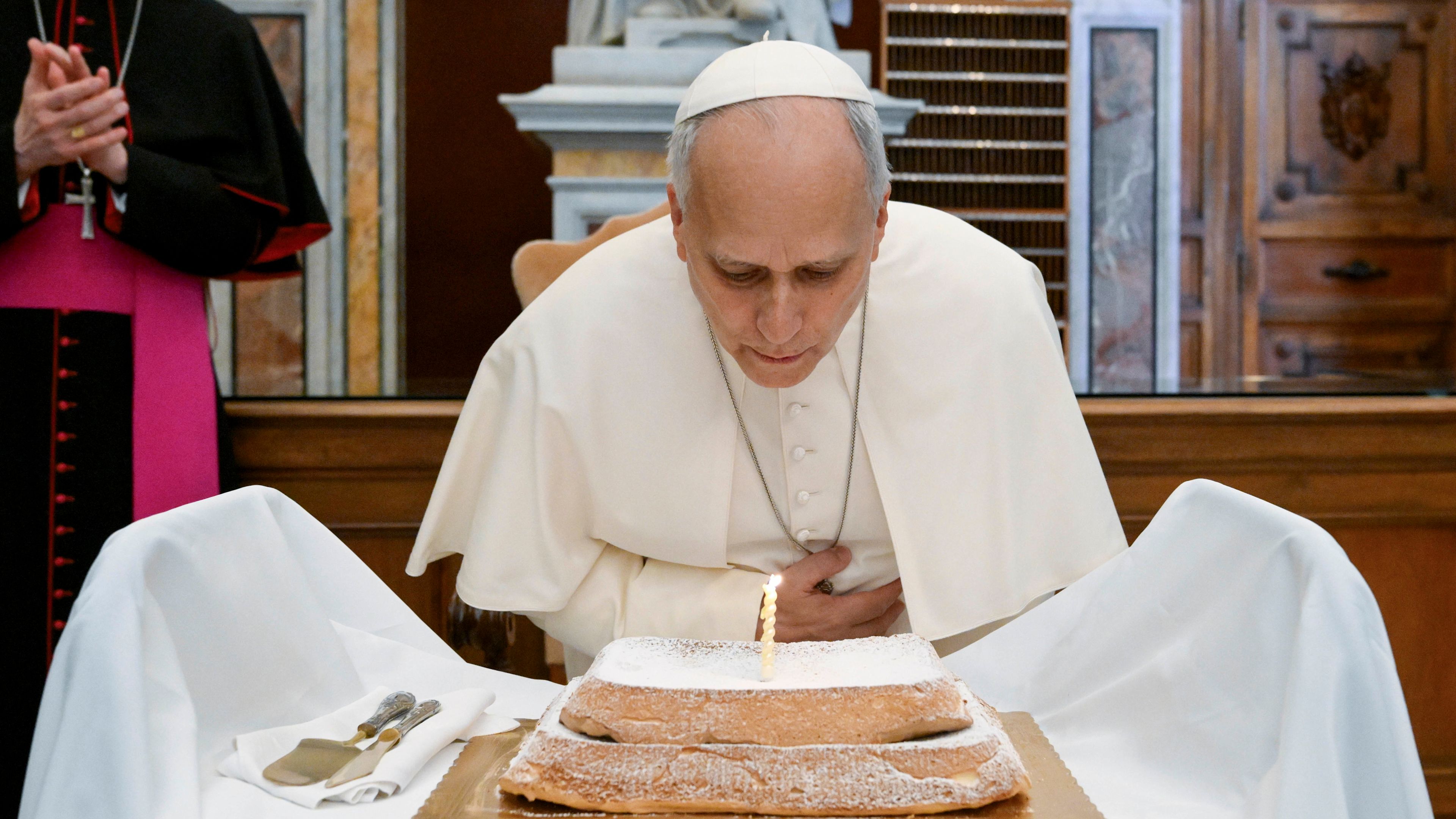 Pope Leo XIV blows out his birthday candle during the launch of the “AQVA Catastrophe and Wonder” exhibition at the Vatican Apostolic Library on Sept. 14, 2026. | Credit: Vatican Media
