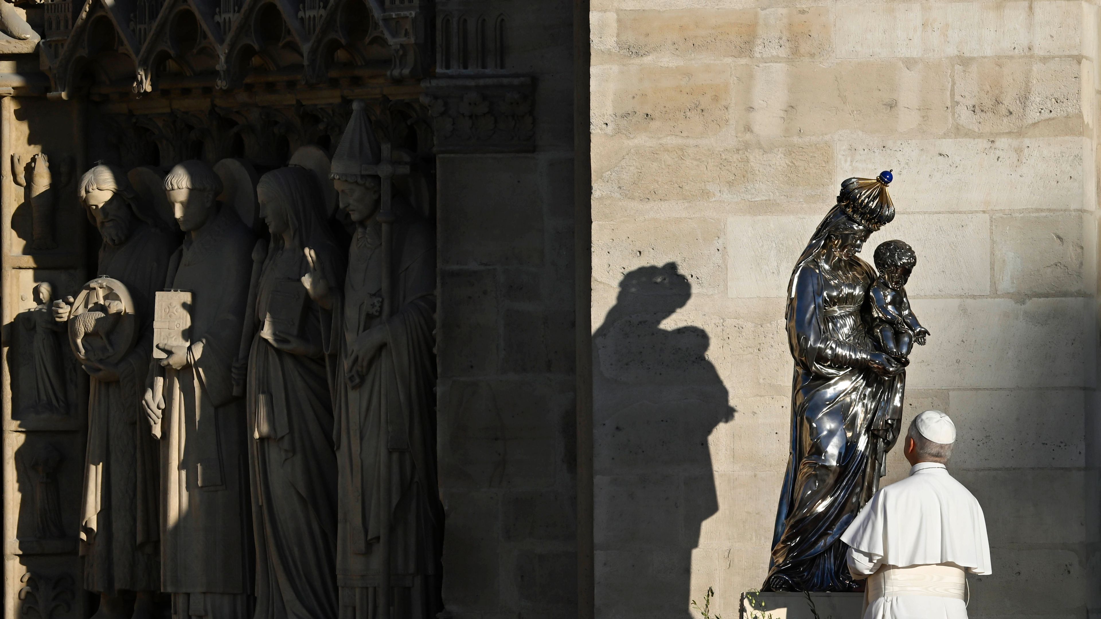 Pope Leo XIV stands outside Notre-Dame Cathedral in Paris on Sept. 25, 2026 to pray the Salve Regina before the statue of Our Lady and the Infant Jesus. Commissioned in the early 19th century and crafted by goldsmith Charles-Nicolas Odiot, the statue survived being thrown from the archbishop's palace during the riots of 1831 and later narrowly escaped being melted down. | Credit: Vatican Media