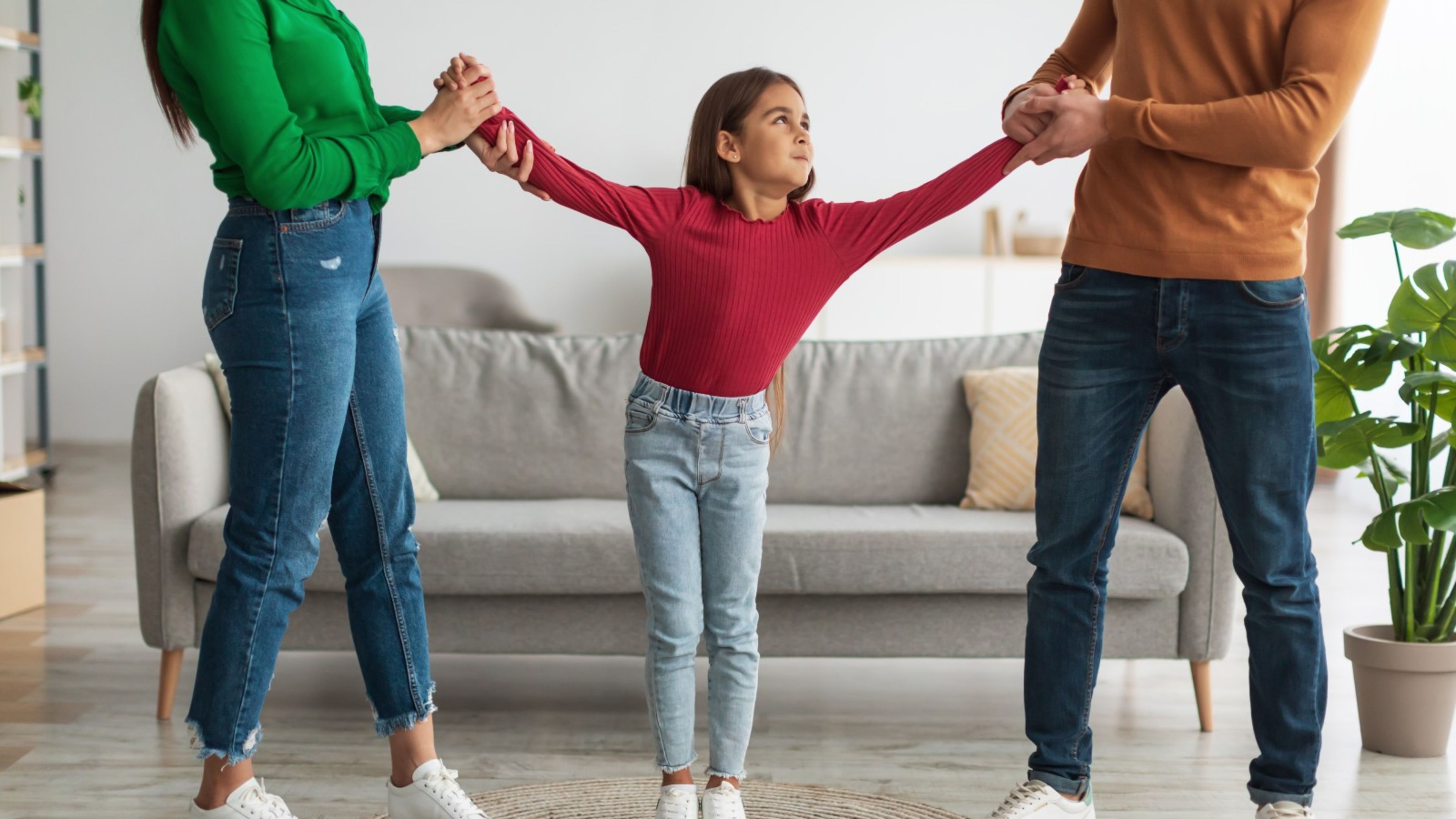 The child of divorced parents faces a balancing act of loyalties. | Credit: Shutterstock.