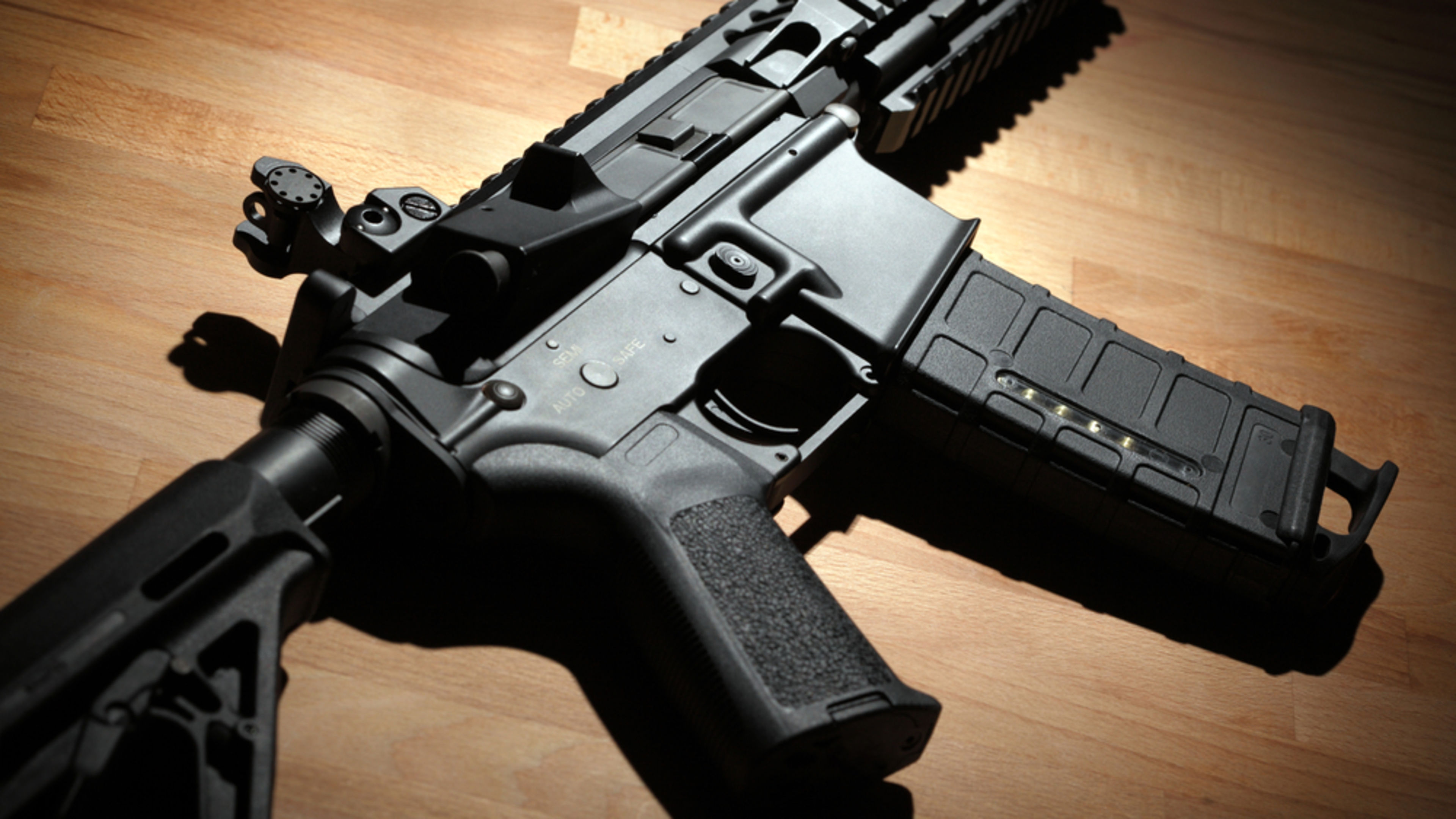 An M4A1 carbine rests on a tabletop. | Credit: Anatoly Vartanov/Shutterstock