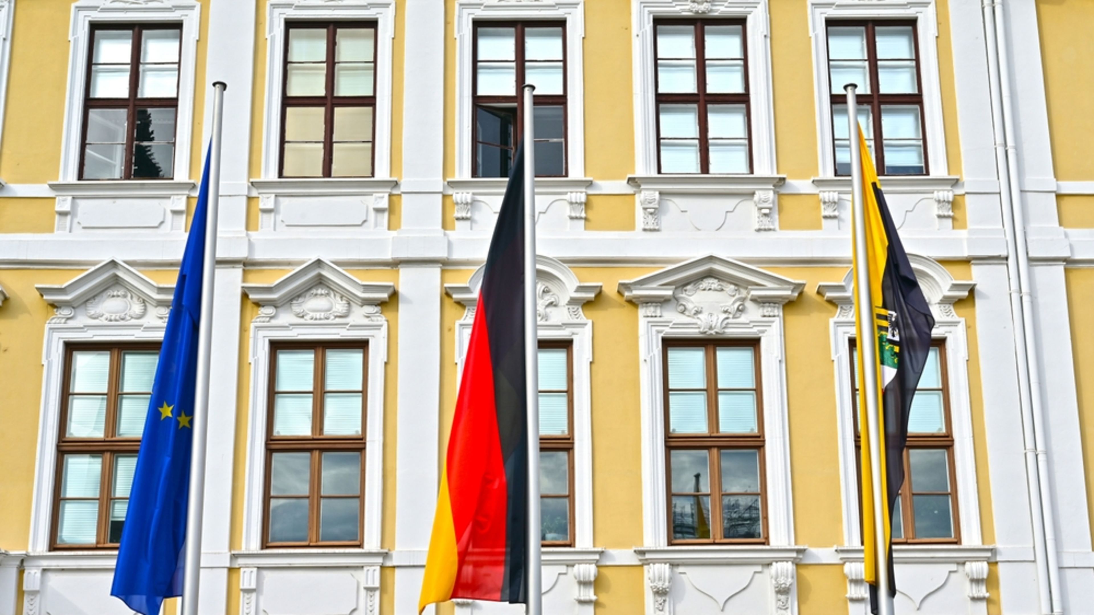 The European Union, German, and Saxony-Anhalt flags fly outside the state Parliament in Magdeburg, Germany, in an undated photo. | Credit: Spitzi-Foto/Shutterstock