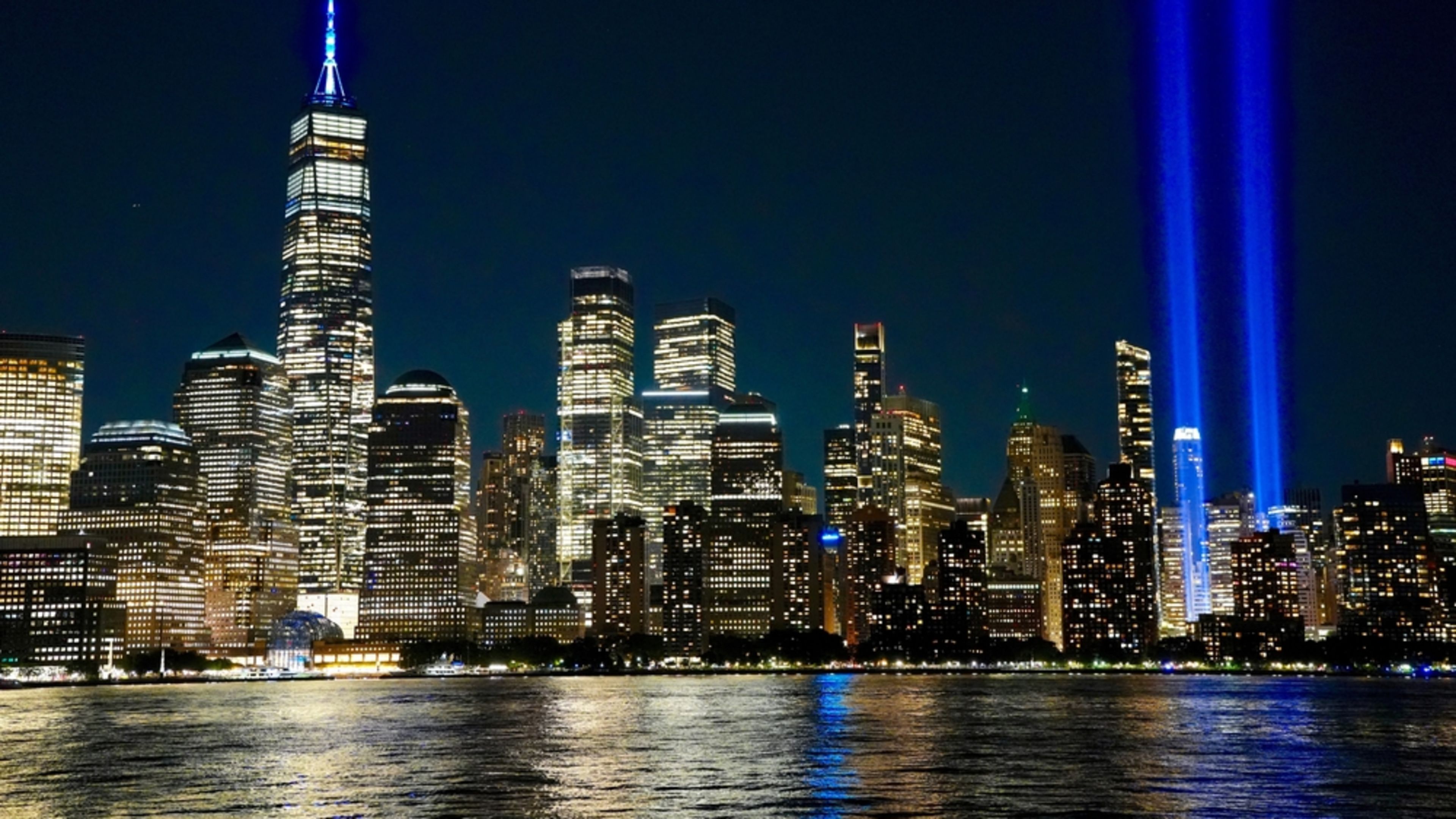 The Tribute in Light annual 9/11 Memorial’s twin shafts of light soar skyward over Manhattan’s skyscrapers in 2025. | Credit: George Wirt/Shutterstock