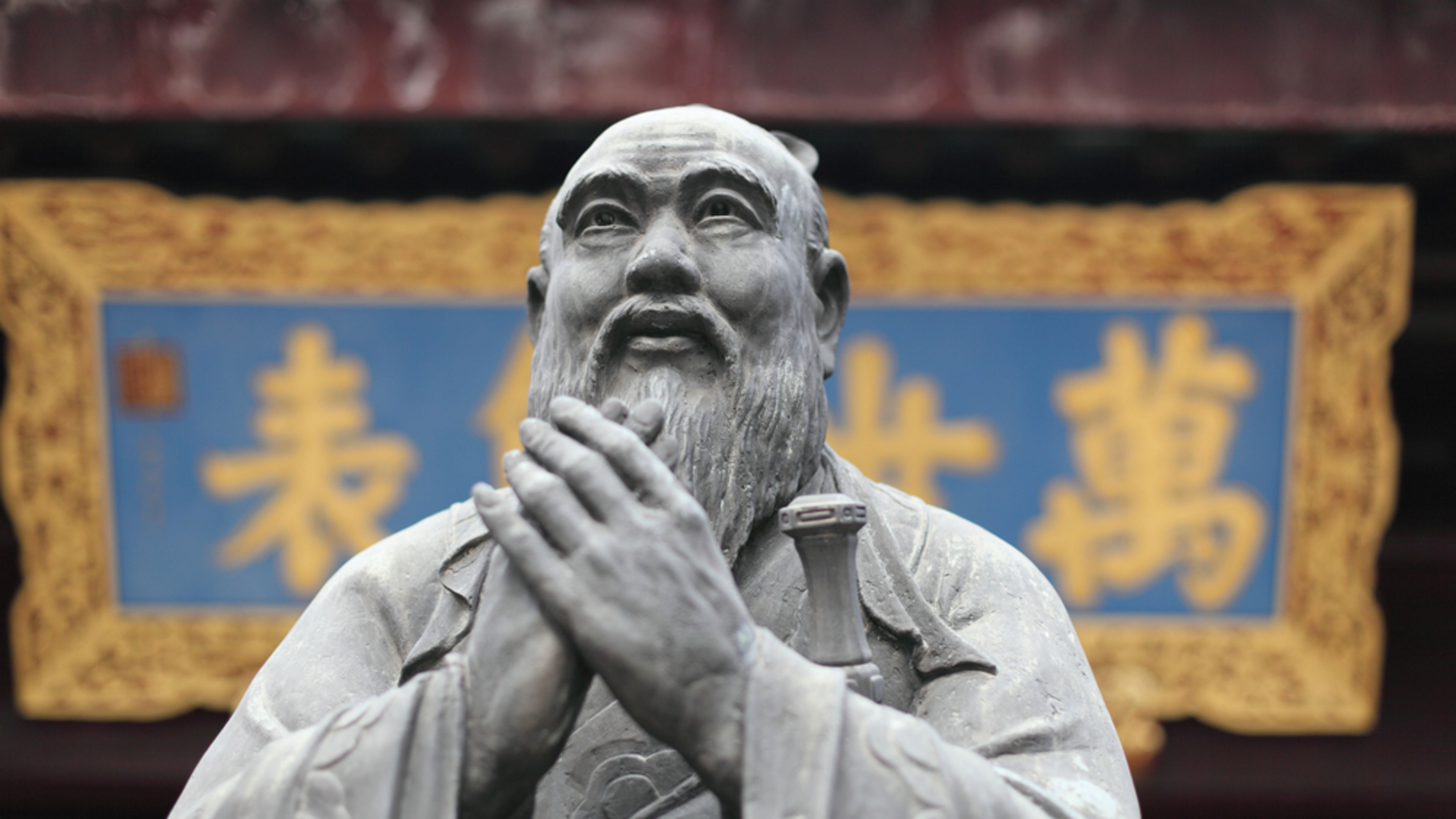 Statue of Confucius at Confucian Temple in Shanghai, China. | Credit: Philip Lange/Shutterstock
