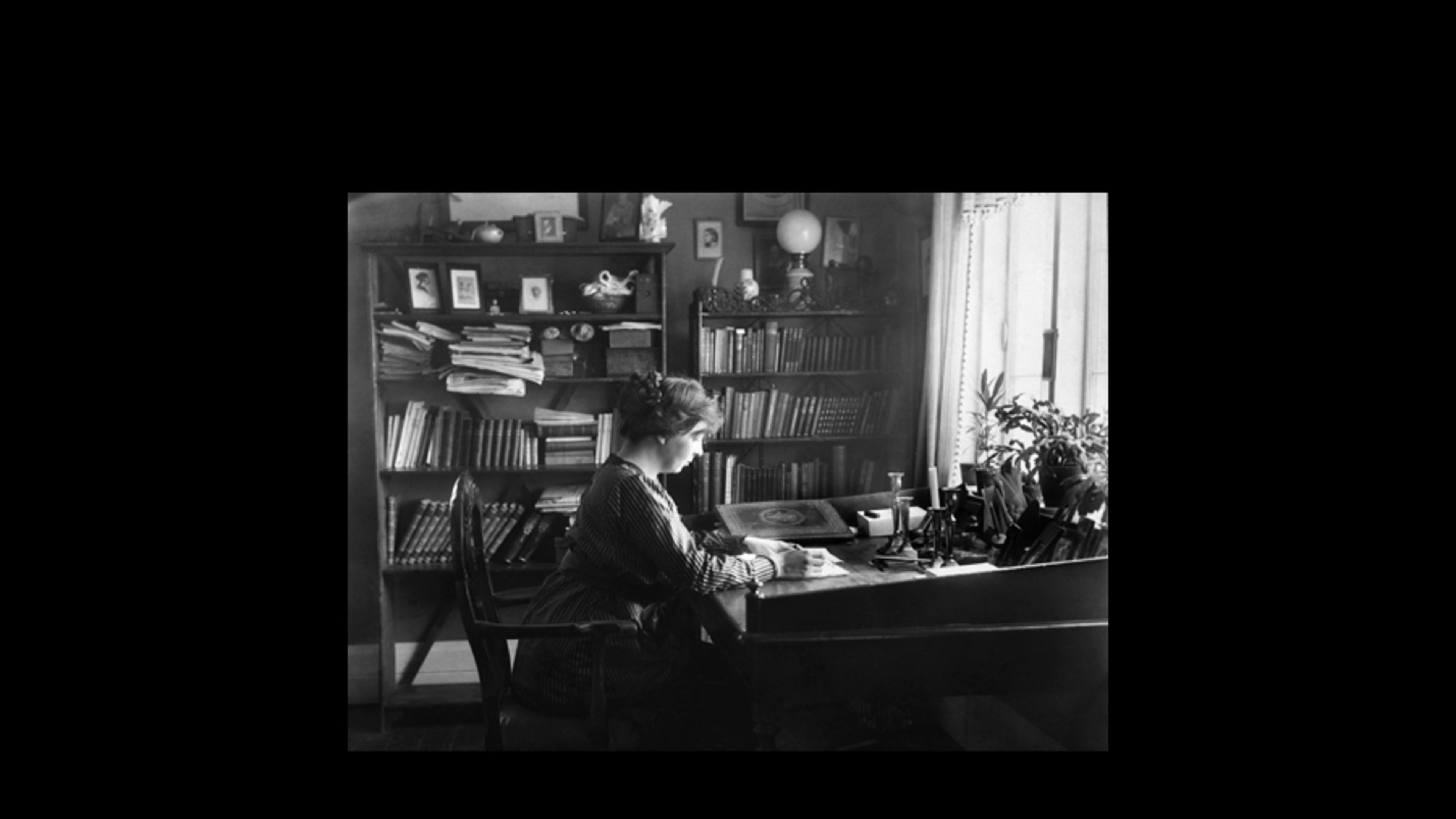 Sigrid Undset, author of “Kristin Lavransdatter,” writes at Bjerkebæk, her home in Lillehammer, Norway. | Credit: Public domain