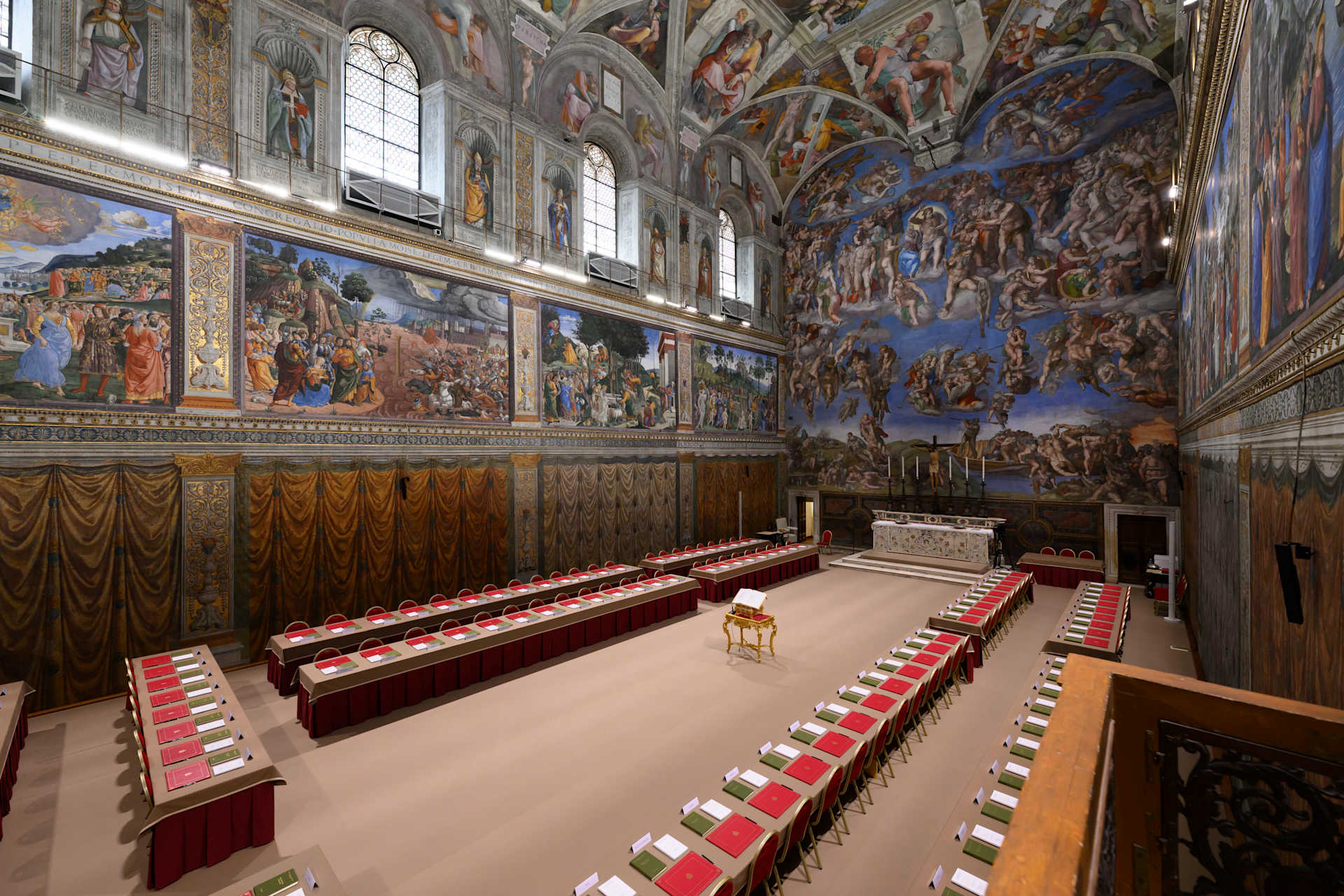 Tables and chairs sit in the Sistine Chapel waiting for the arrival of cardinals for the conclave to elect the next pope, Tuesday, May 6, 2025. Credit: Vatican Media