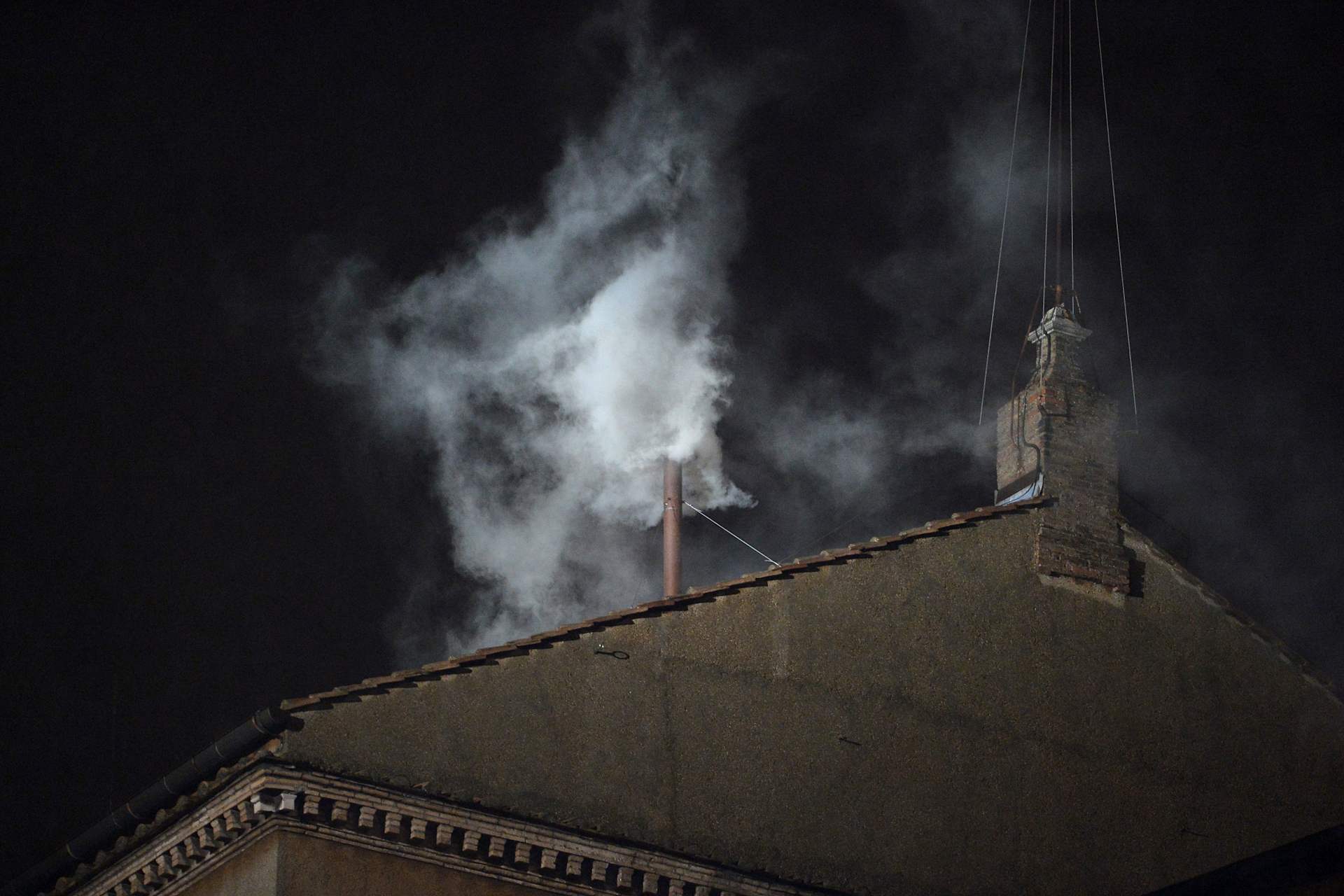 White smoke rises from the chimney of the Sistine Chapel on March 13, 2013, signaling that the College of Cardinals has elected a new pope. | Credit: ALBERTO PIZZOLI/AFP via Getty Images 