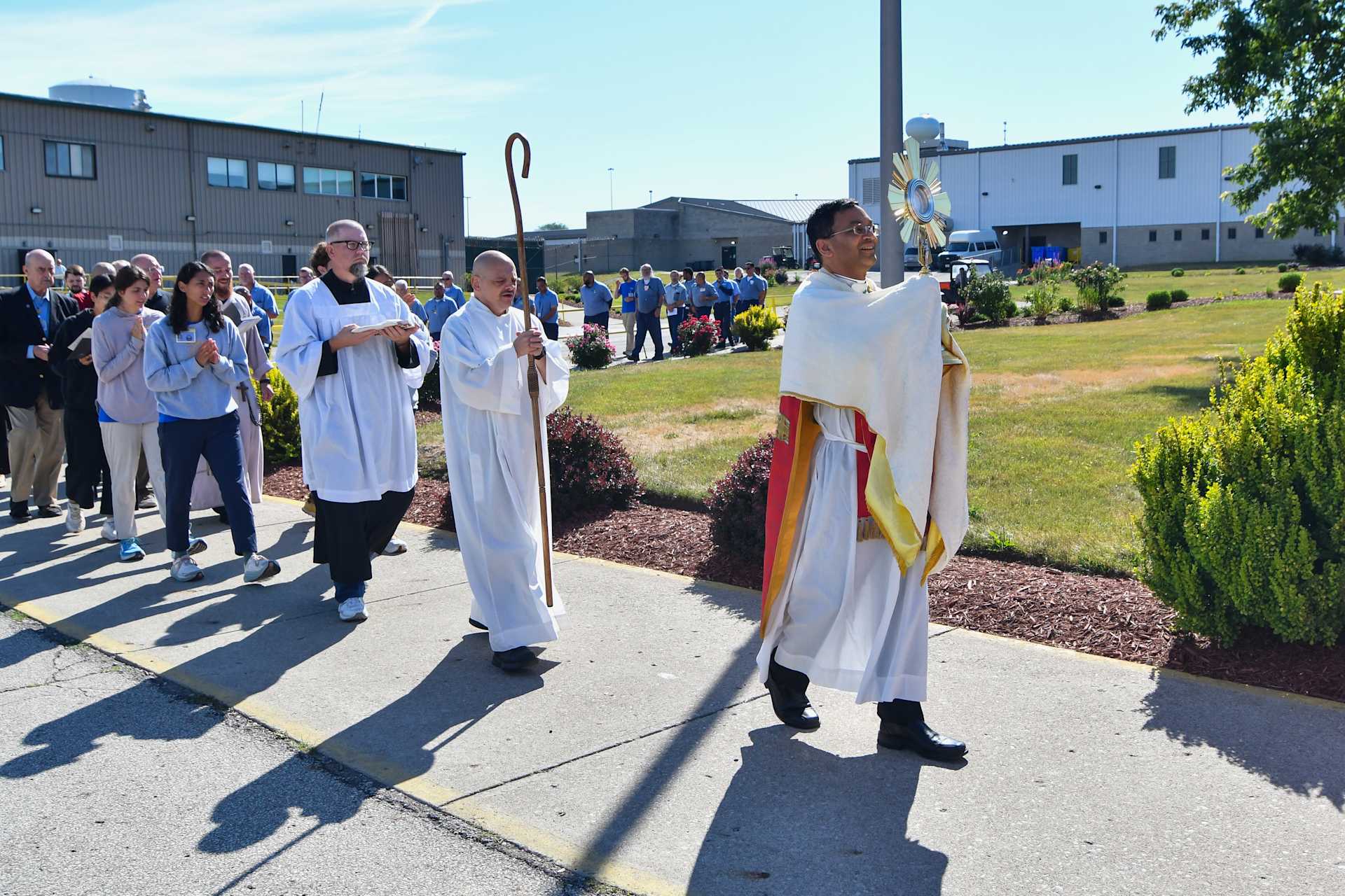 Bishop Earl Fernandes of Columbus, Ohio, carries the Blessed Sacrament during a procession at Pickaway Correctional Institution on June 28, 2024, at one of the stops on the Seton Route of the National Eucharistic Pilgrimage. Credit: Catholic Times/Ken Snow?w=200&h=150