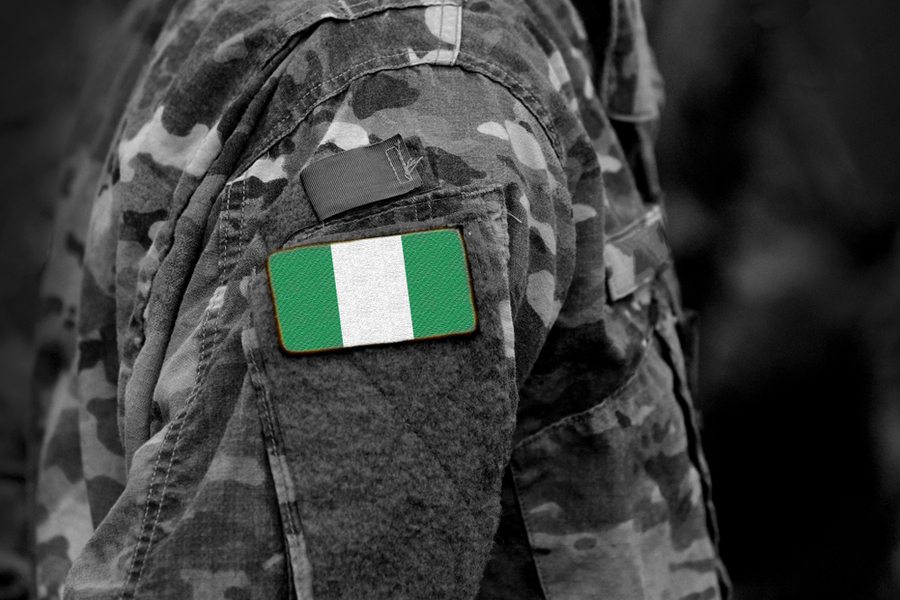 Flag of Nigeria on soldiers arm.  -  Bumble Dee/Shutterstock