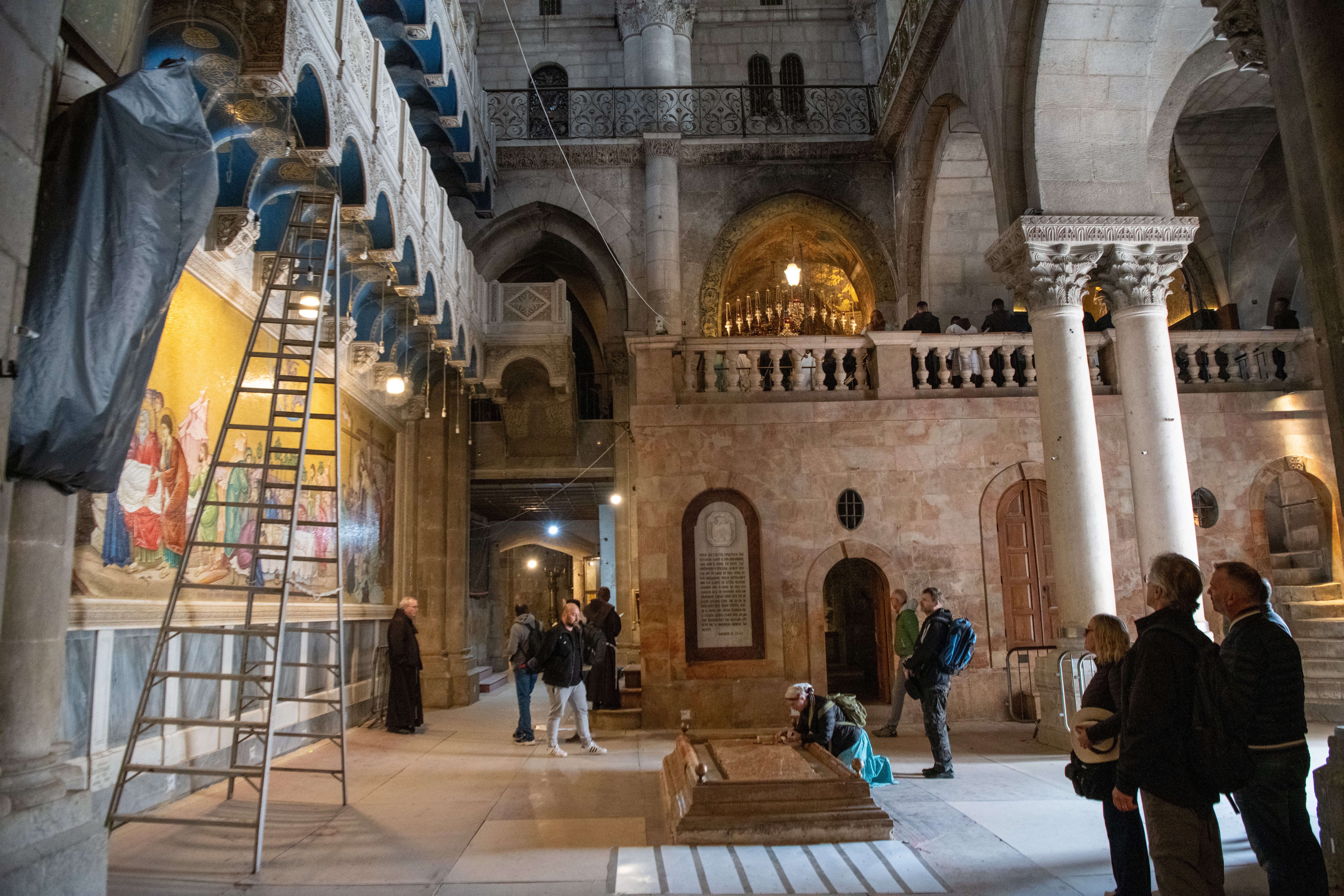 The interior of the Basilica of the Holy Sepulcher in Jerusalem. In the center, the Stone of Anointing, with Calvary in the background. | Credit: Marinella Bandini