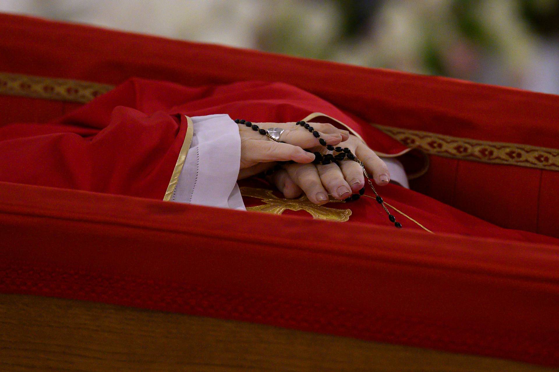 Pope Francis' hands are seen as his body lies in state at the Vatican's Domus Sanctae Marthae chapel, Monday, April 21, 2025. - Credit: Vatican Media