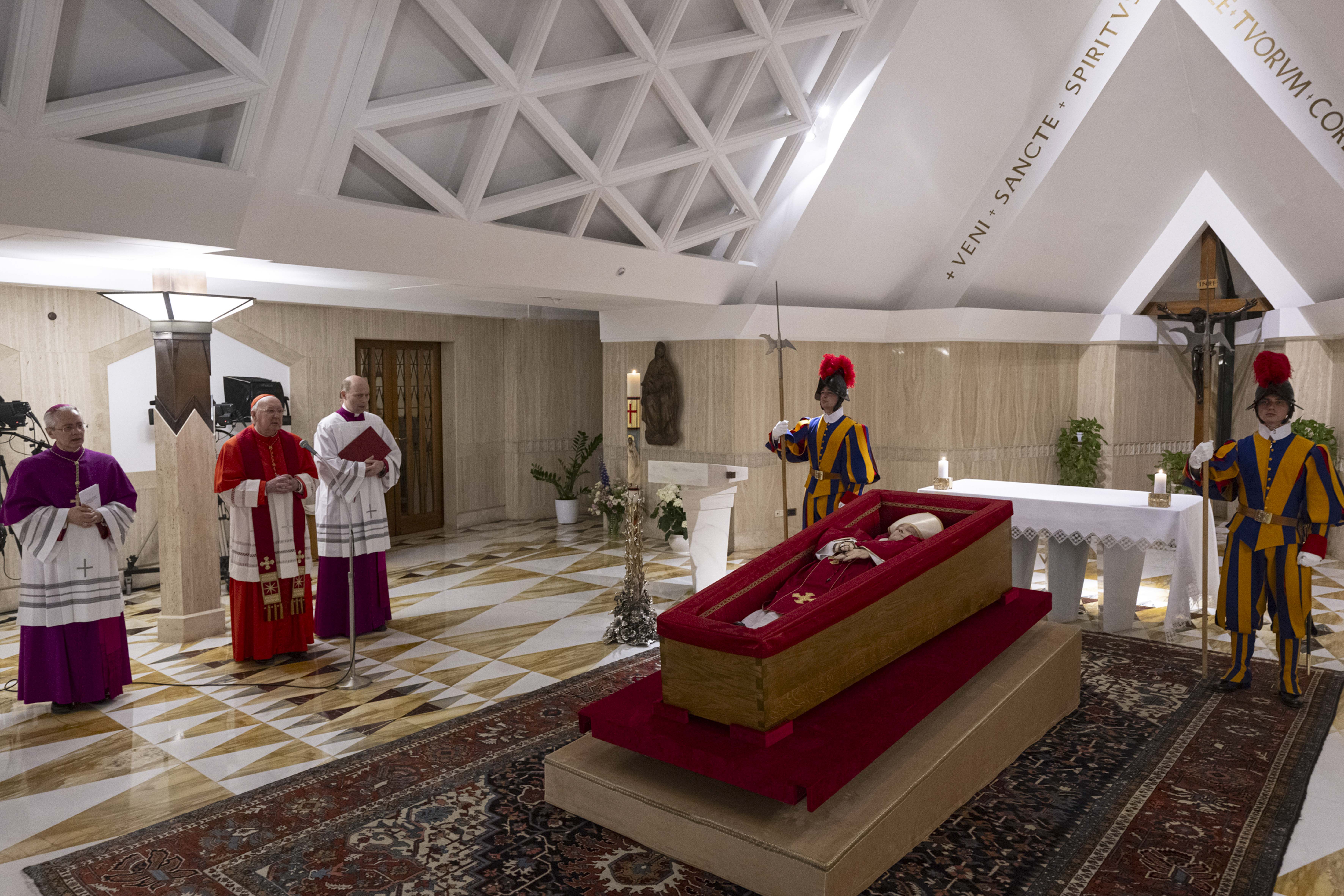 The body of Pope Francis lies in state at the Vatican's Domus Sanctae Marthae chapel, surrounded by Swiss Guards, cardinals, and Vatican officials paying their respects before his transfer to St. Peter's Basilica for public veneration, Monday, April 21, 2025. - Credit: Vatican Media
