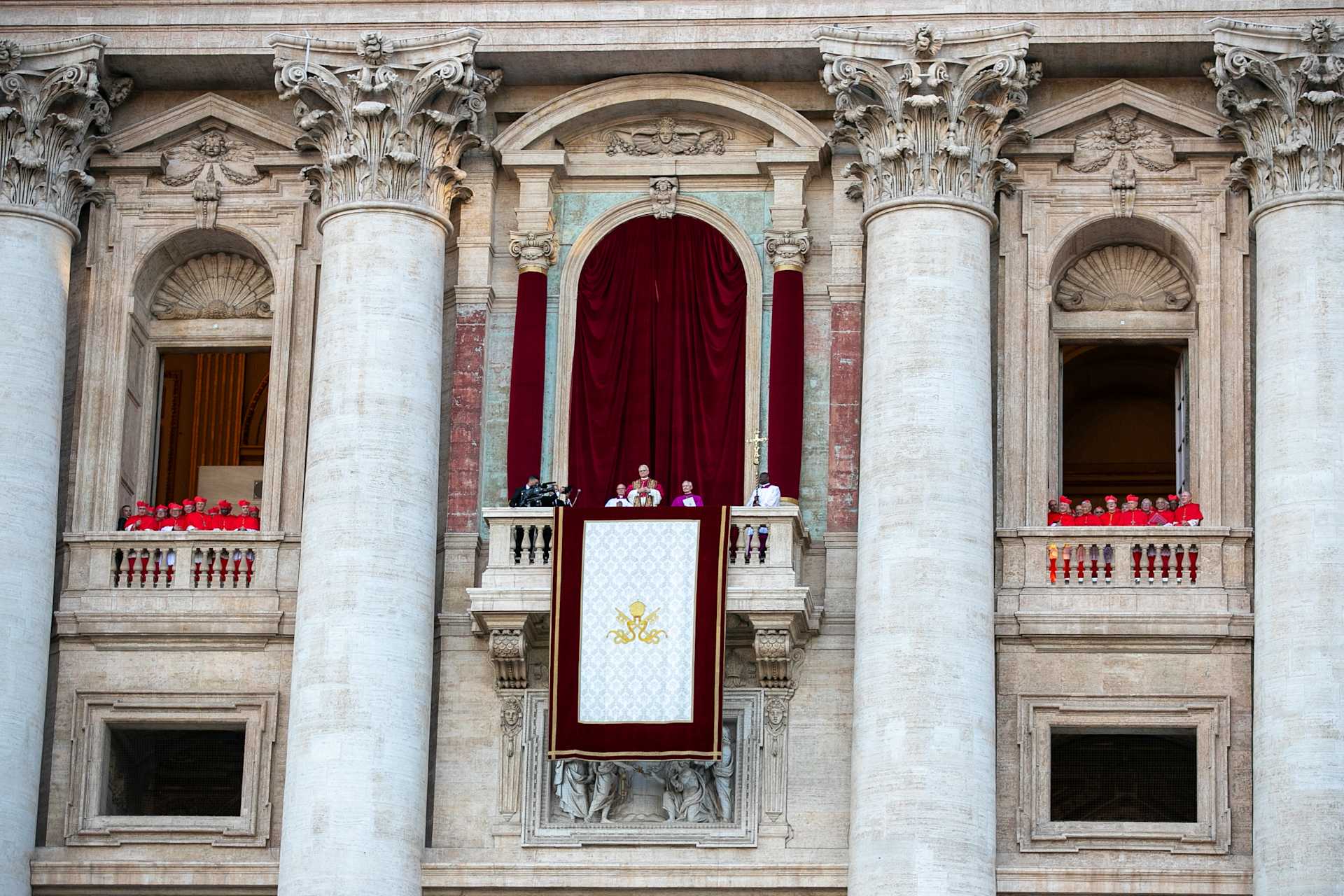 Pope Leo XIV is seen flanked by cardinals at St. Peter's Basilica shortly after his election, Thursday, May 8, 2025 - Credit: Daniel Ibáñez/CNA