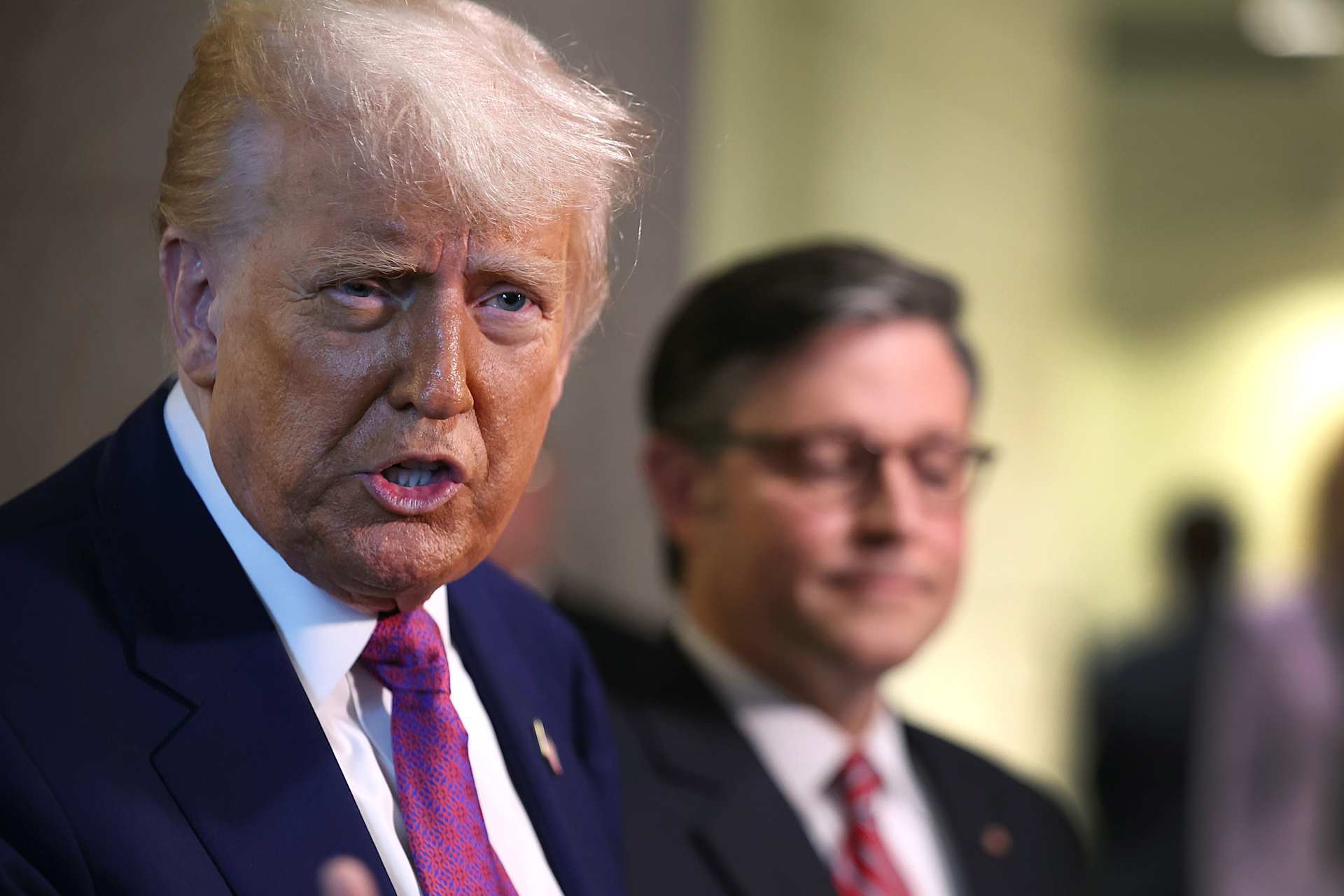With Speaker of the House Mike Johnson by his side, President Donald Trump speaks to the press following a House Republican meeting at the U.S. Capitol on May 20, 2025, in Washington, D.C. | Credit: Tasos Katopodis/Getty Images