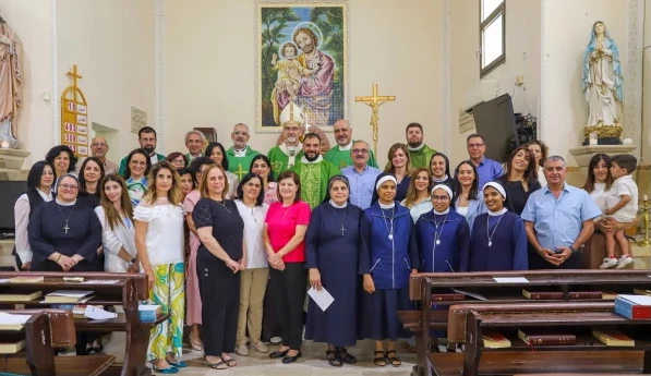 Cardinal Pierbattista Pizzaballa and the priests who concelebrated Mass pause for a photo with the catechism teachers at a Mass on Sept. 27, 2025. Credit: Latin Patriarchate of Jerusalem