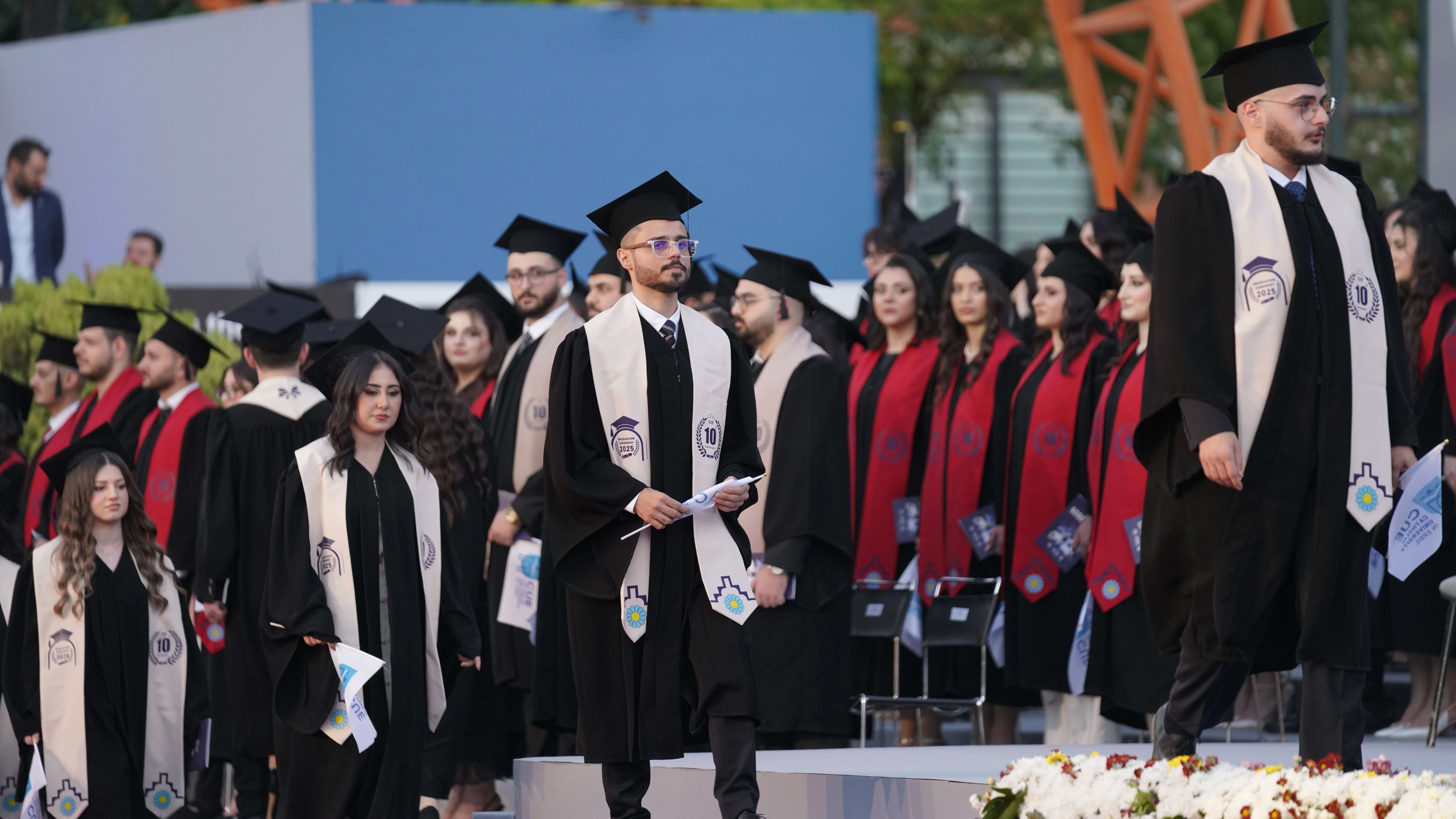 A student crosses the stage after receiving his diploma at the Catholic University of Erbil in Iraq graduation ceremony on Sept. 30, 2025. Credit: ACI MENA