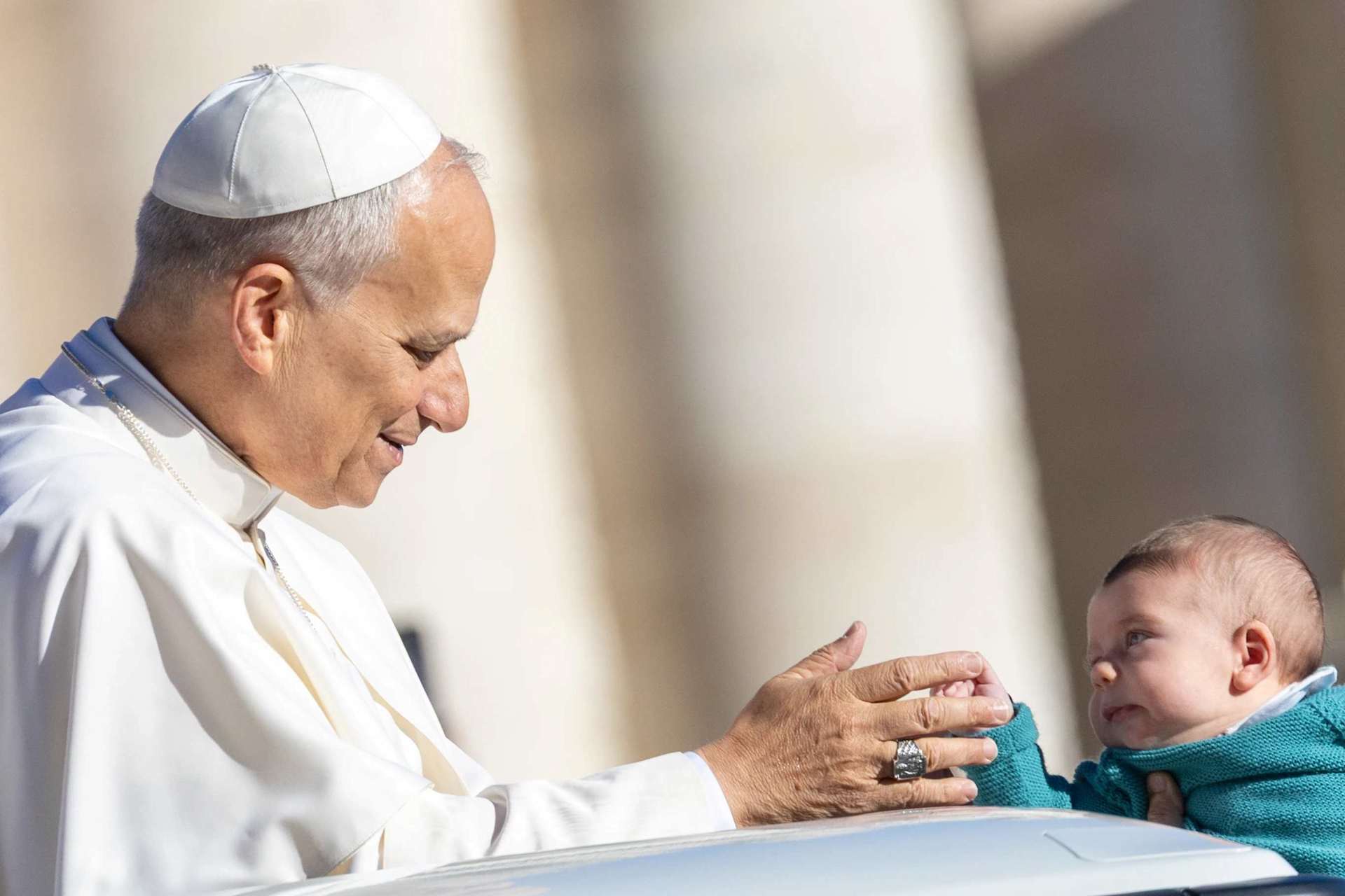 Pope Leo XIV greets a baby at his general audience in St. Peter's Square at the Vatican, Wednesday, Oct. 8, 2025. Credit: Daniel Ibáñez/CNA