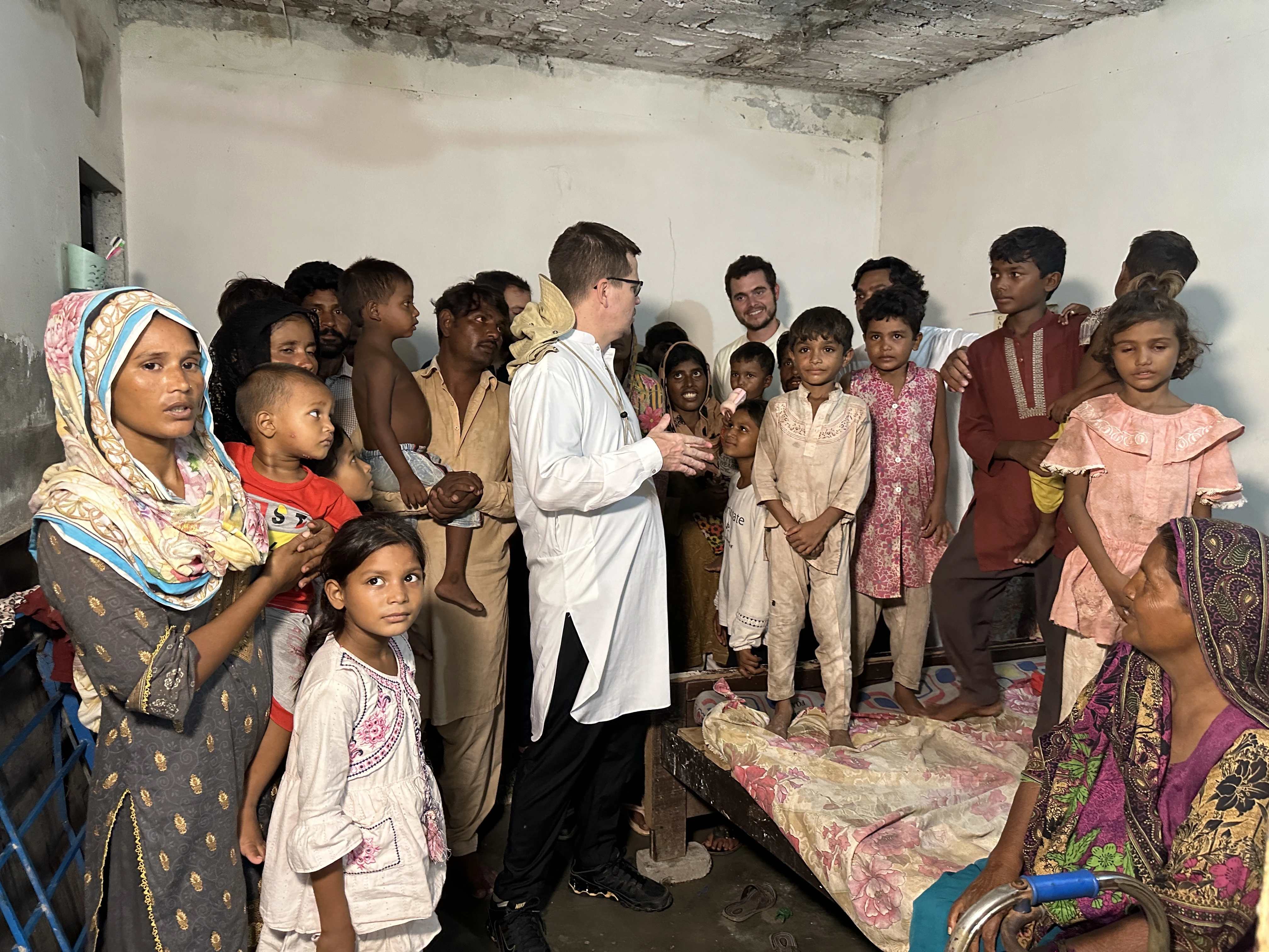 Father Rico is pictured with Christian children and family members in Pakistan whom he has ransomed from debt bondage. According to the U.N., between 3.5 million and 5 million people are engaged in bonded or forced labor in which whole families are compelled to work. Credit: Photo courtesy of the Order of St. Elias