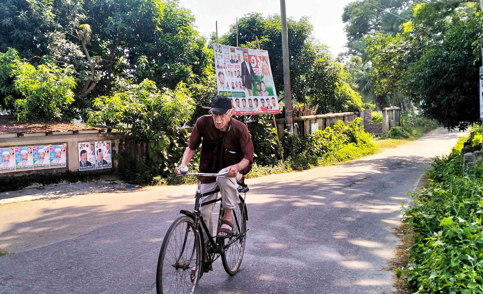 Father Robert Terence McCahill, 88, rides his bicycle through rural villages in Munshigonj district, Bangladesh, on Nov. 18, 2025. Credit: Stephan Uttom Rozario