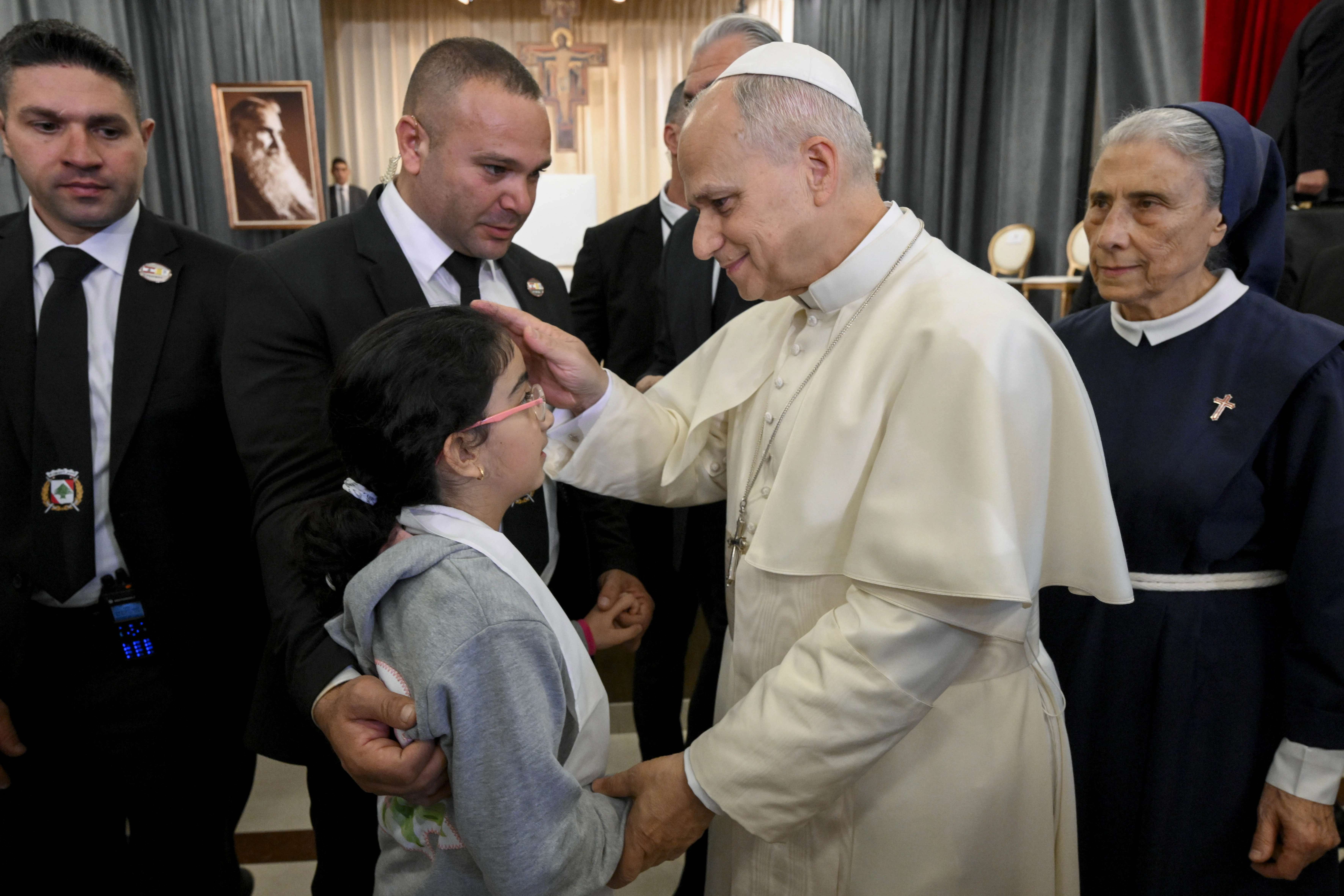 Pope Leo XIV blesses a child at the De La Croix Hospital for the mentally disabled in Jal el Dib, north of Beirut, Lebanon, on Dec. 2, 2025. | Credit: Vatican Media