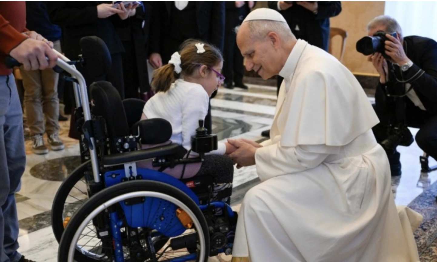 Pope Leo XIV greets a girl in a wheelchair during an audience with members of Italian Catholic Action on Dec. 19, 2025 at the Vatican. Credit: Vatican Media
