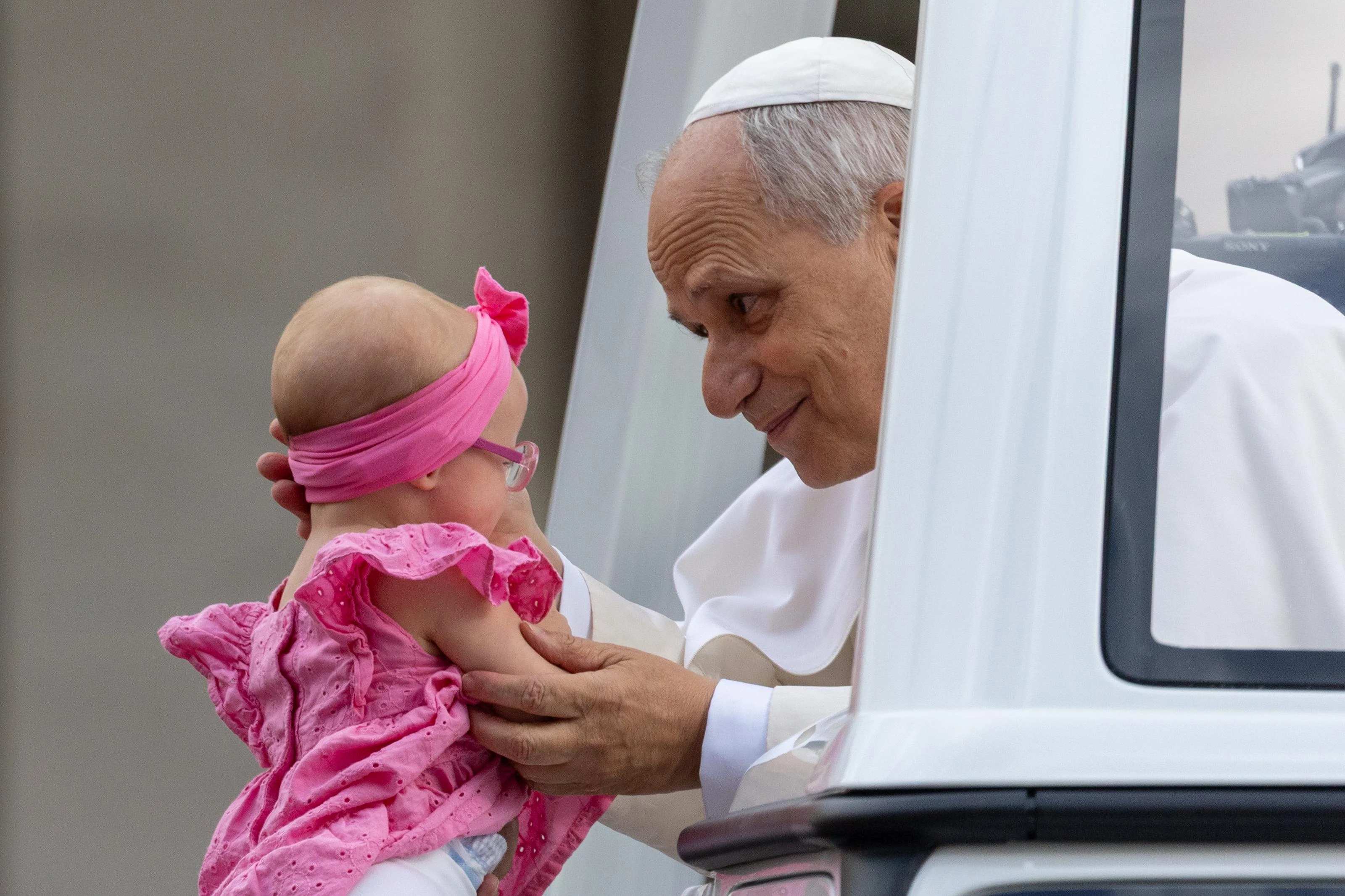 Pope Leo XIV blesses a baby during his general audience on Sept. 24, 2025, in St. Peter’s Square at the Vatican. Credit: Daniel Ibañez/CNA