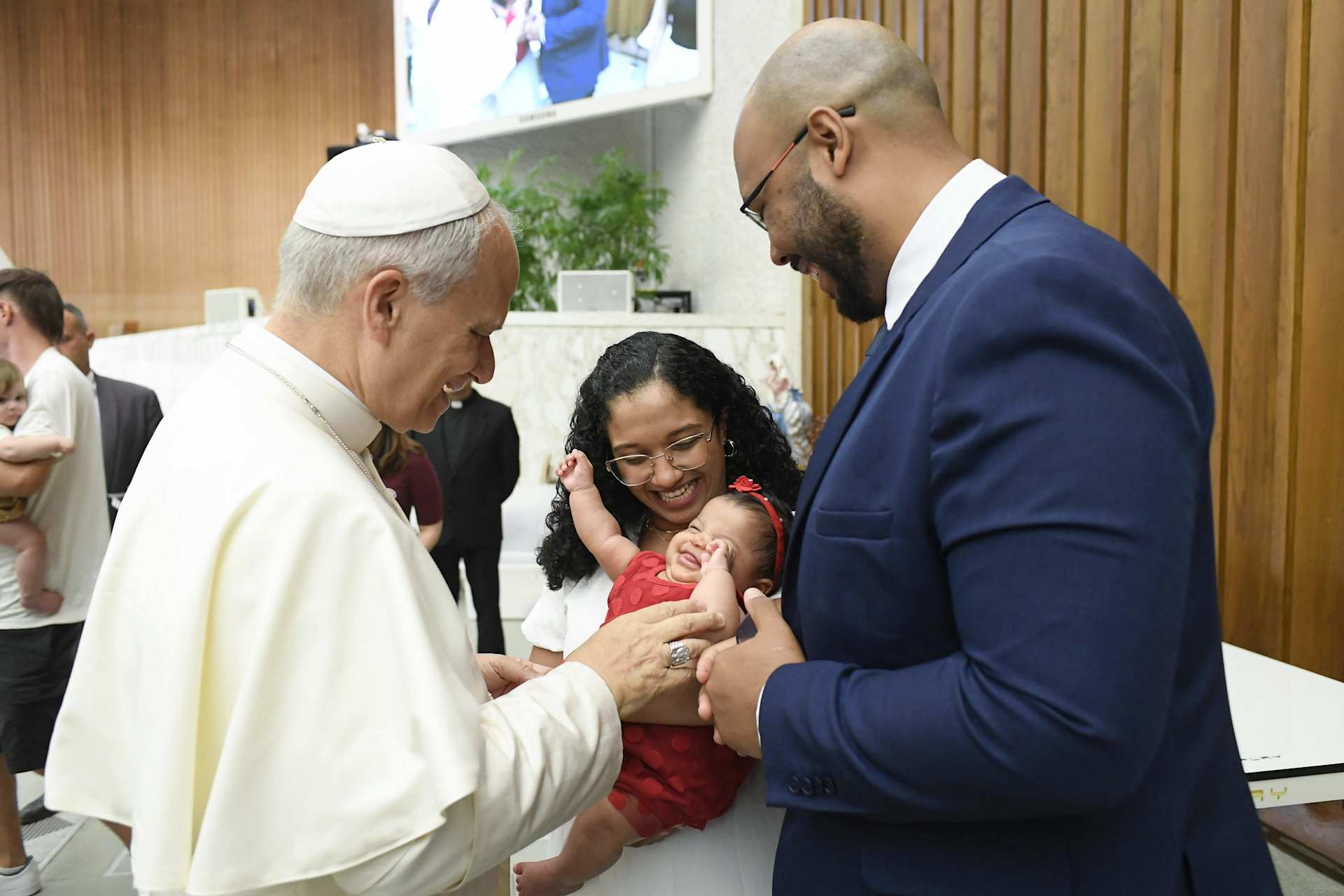 Pope Leo XIV greets a family in Rome. Credit: Vatican Media