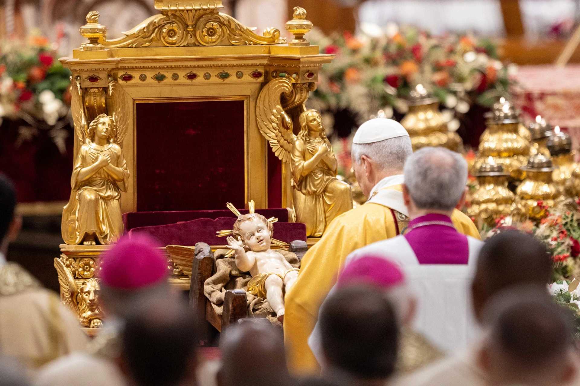 Pope Leo XIV venerates a statue of the child Jesus during the celebration of Christmas Mass during the Night in St. Peter’s Basilica on Dec. 24, 2025. | Credit: Daniel Ibanez/CNA
