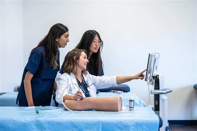 Mount St. Mary’s University Physician Assistant Program Director Mary Jackson, MMS, PA-C, CAQ-EM, demonstrates hands-on ultrasound techniques with students at Mount St. Mary’s University in Emmitsburg, Maryland. | Credit: Photo courtesy of Mount St. Mary’s University