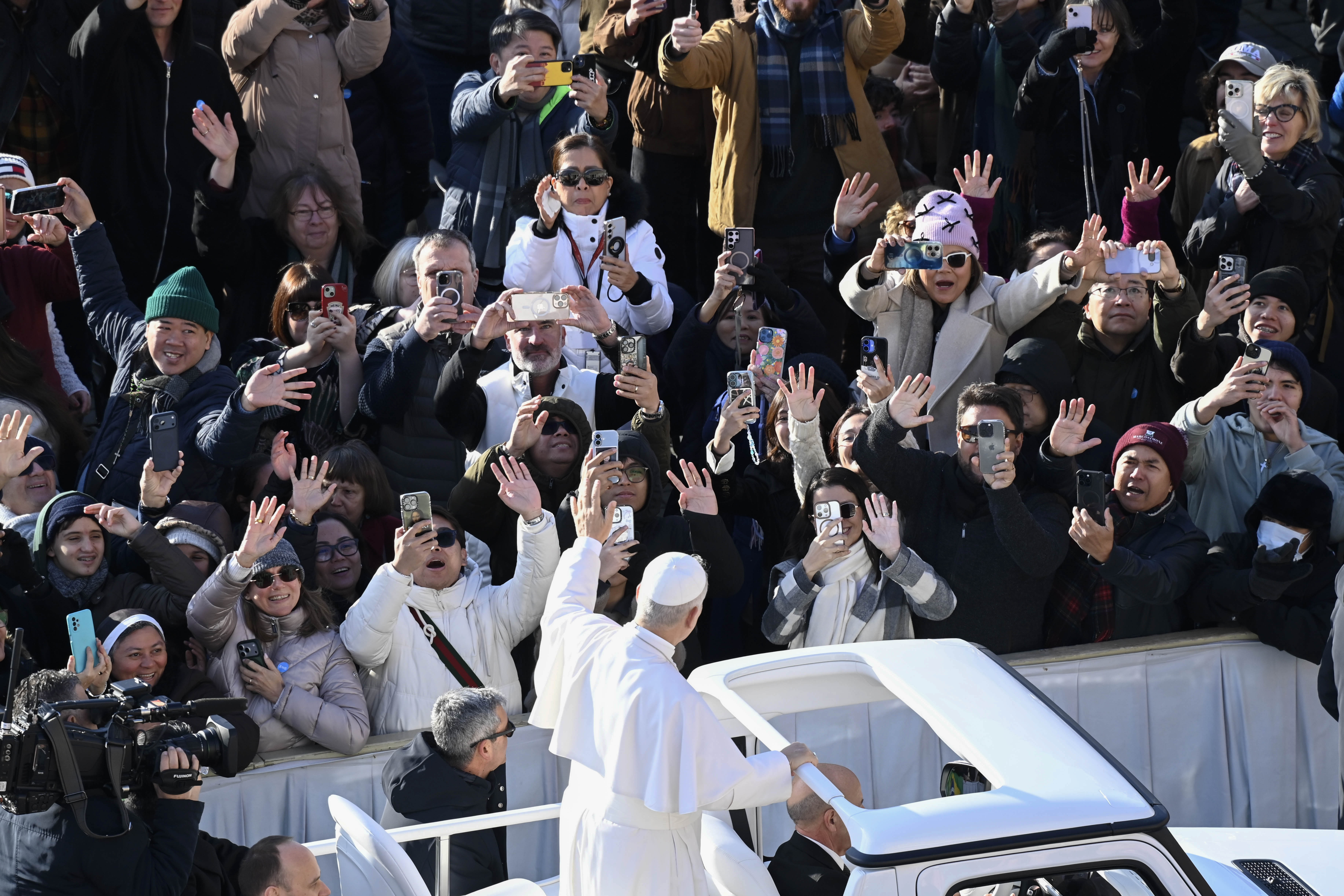 Pope Leo XIV waves from the popemobile to pilgrims gathered for his Wednesday general audience on Dec. 31, 2025, in St. Peter’s Square at the Vatican. | Credit: Vatican Media