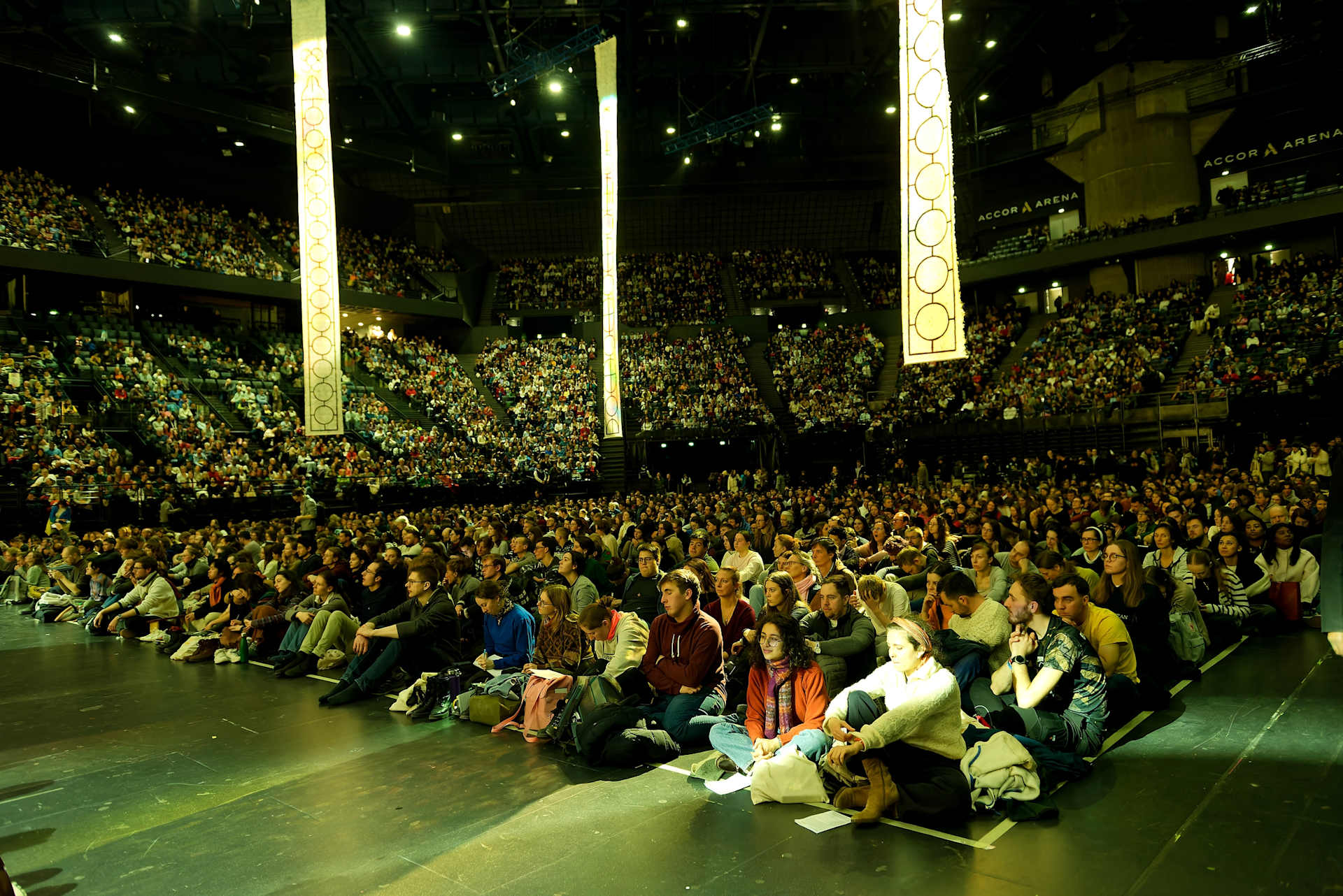 Afternoon prayers for the ecumenical youth gathering are taking place in the Accor Arena, which can accommodate more than 20,000 people. Credit: Taizé Community