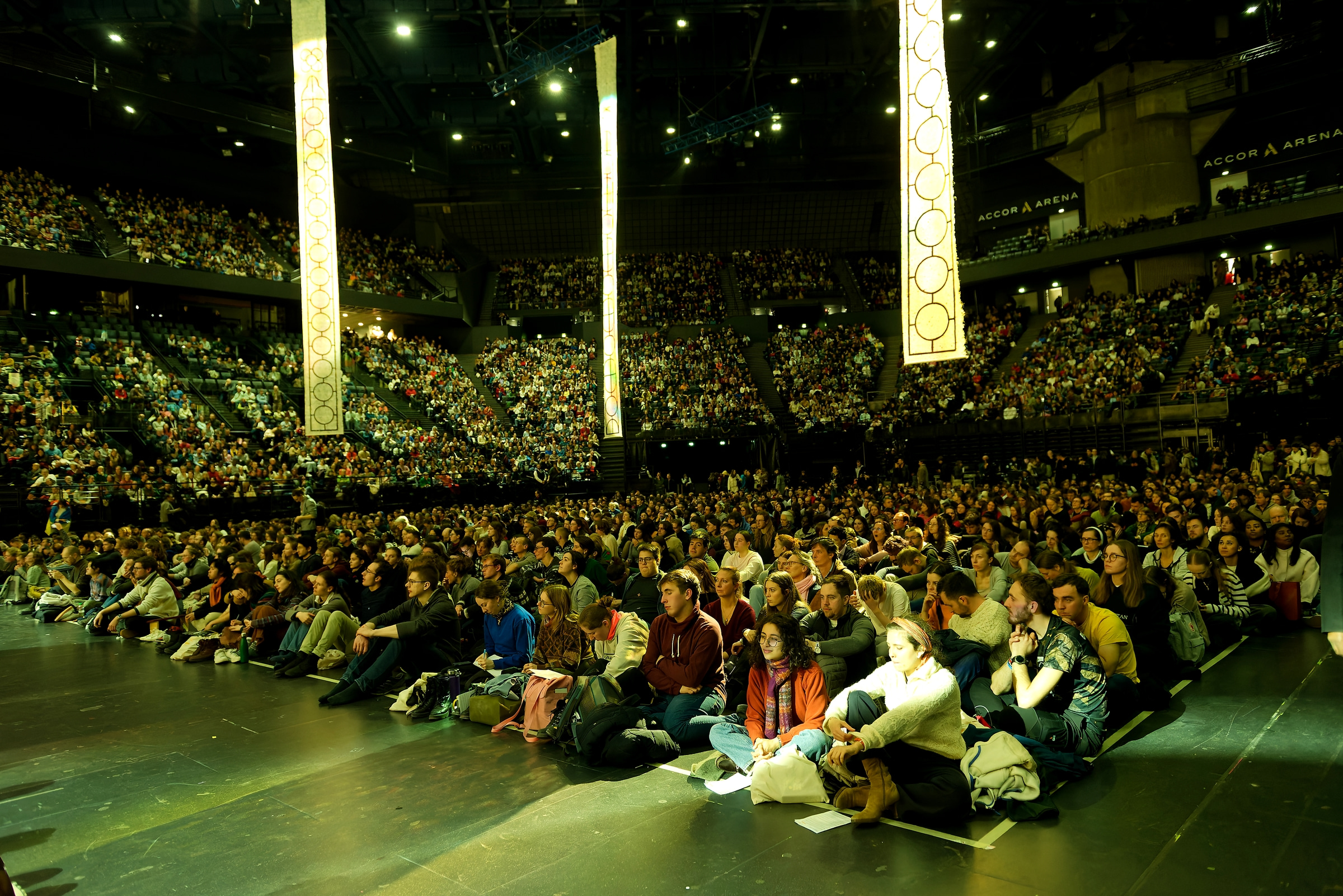 Afternoon prayers for the ecumenical youth gathering are taking place in the Accor Arena, which can accommodate more than 20,000 people. Credit: Taizé Community