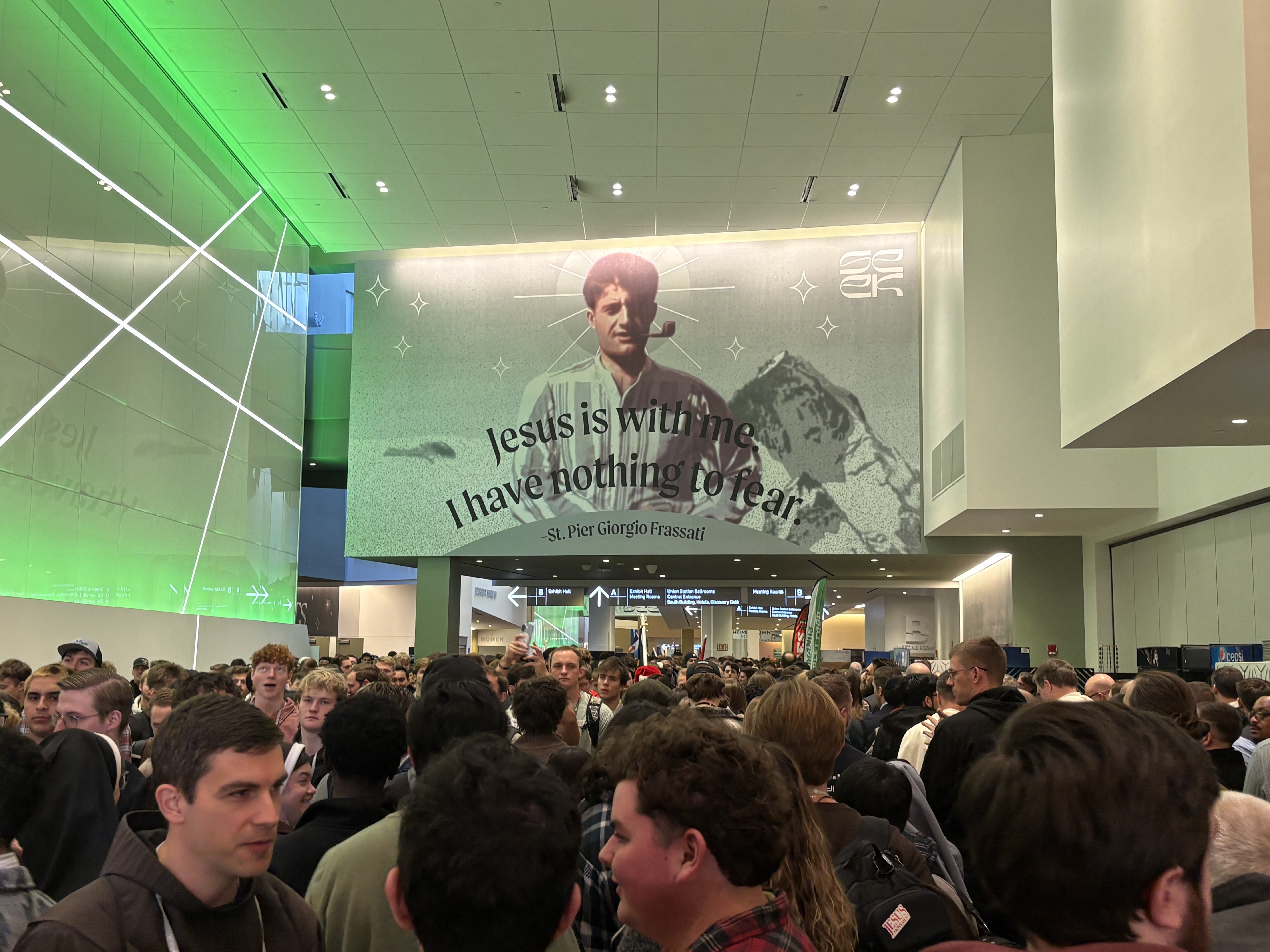Crowds gather at SEEK 2026 beneath a photo of St. Pier Giorgio Frassati in Columbus, Ohio, on Friday, Jan. 2, 2026. | Credit: Gigi Duncan/EWTN News