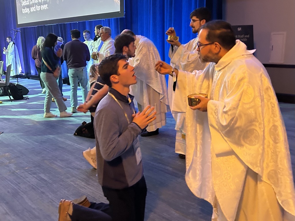 Dozens of priests help distribute Communion to the 4,500 attendees at Mass on opening night of SEEK 2026 on the solemnity of Mary, Mother of God, Jan. 1, 2026, in Forth Worth, Texas. | Credit: Amira Abuzeid/CNA
