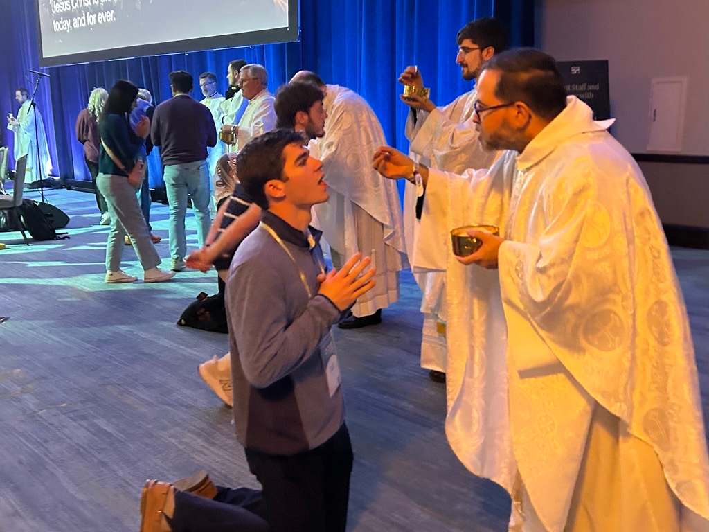 Dozens of priests help distribute Communion to the 4,500 attendees at Mass on opening night of SEEK 2026 on the solemnity of Mary, Mother of God, Jan. 1, 2026, in Forth Worth, Texas. | Credit: Amira A...