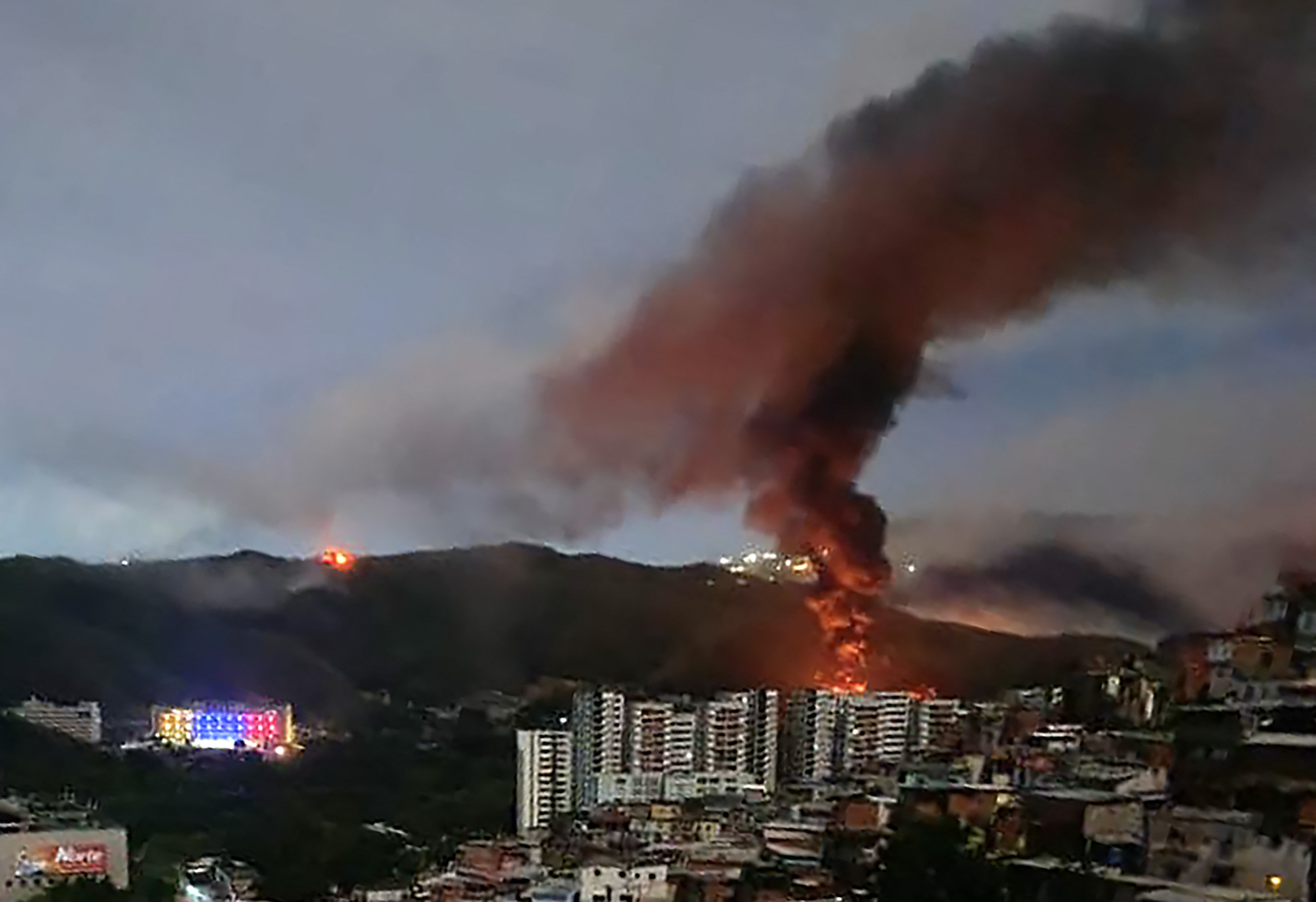 Fires are seen in Caracas, Venezuela after the U.S. launched what President Donald Trump described as a "large scale strike" that included the capture of Venezuelan President Nicolás Maduro, Saturday,...