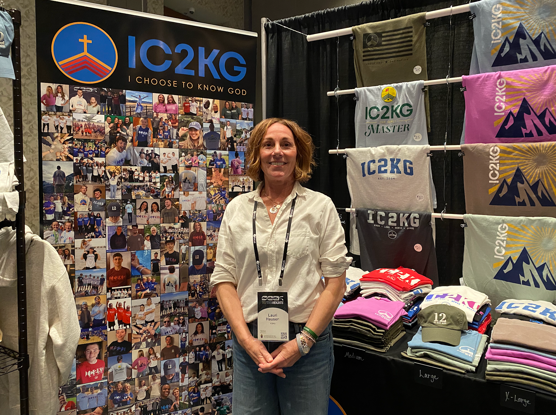 Lauri Hauser stands in front of her IC2KG booth at the SEEK 2026 conference in Denver on Jan. 2, 2026. | Credit: Francesca Fenton/EWTN News