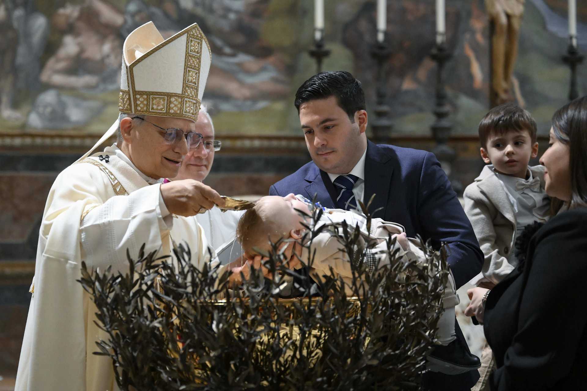 Pope Leo XIV baptizes a child in the Sistine Chapel at the Vatican on the Feast of the Baptism of the Lord, January 11, 2026. | Vatican Media
