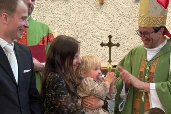 Bishop Raimo Goyarrola with a family in Helsinki | Credit: Courtesy of Bishop Raimo Goyarrola