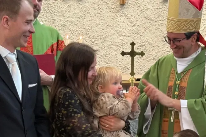 Bishop Raimo Goyarrola with a family in Helsinki | Credit: Courtesy of Bishop Raimo Goyarrola